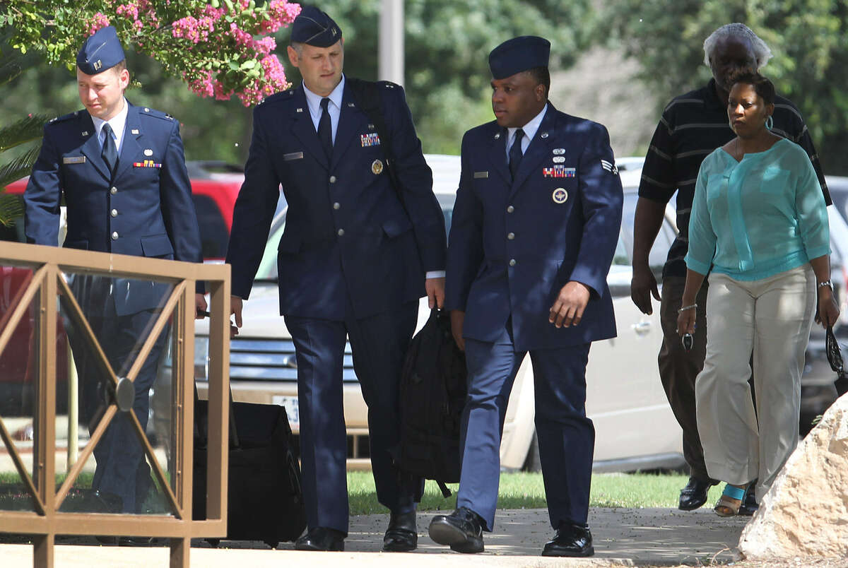 Senior Airman Christopher Oliver (second from left) pleaded guilty Monday to having liaisons with three recruits.