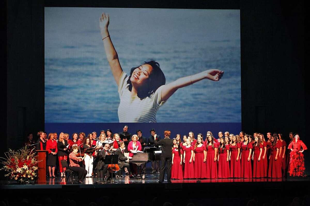 Friends and fellow performers sing "Somewhere Over the Rainbow," at the War Memorial Opera House during a memorial concert for Zheng Cao on Monday, June 24, 2013, in San Francisco, Calif. The Chinese-born mezzo soprano died this year after a long struggle with cancer.