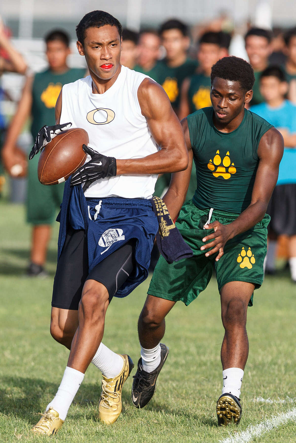 O'Connor wide receiver Nate Phillips (left) catches a pass against Holmes June 20 during 7-on-7 competition at the NISD soccer fields.