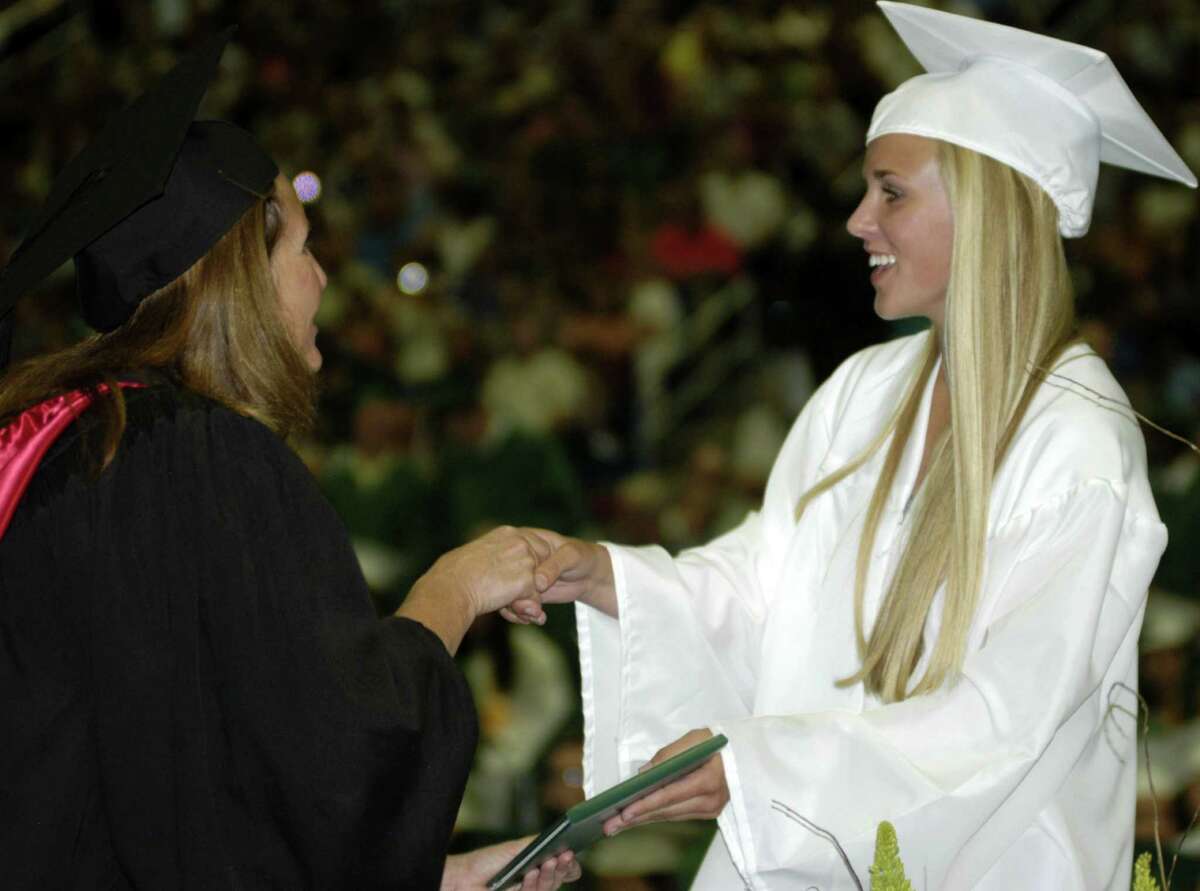 Claudia Taylor receives her diploma from Board of Education chairwoman Wendy Faulenbach during New Milford High School's commencement exercises at the O'Neill Center on the campus of Western Connecticut State University in Danbury. June 22, 2013