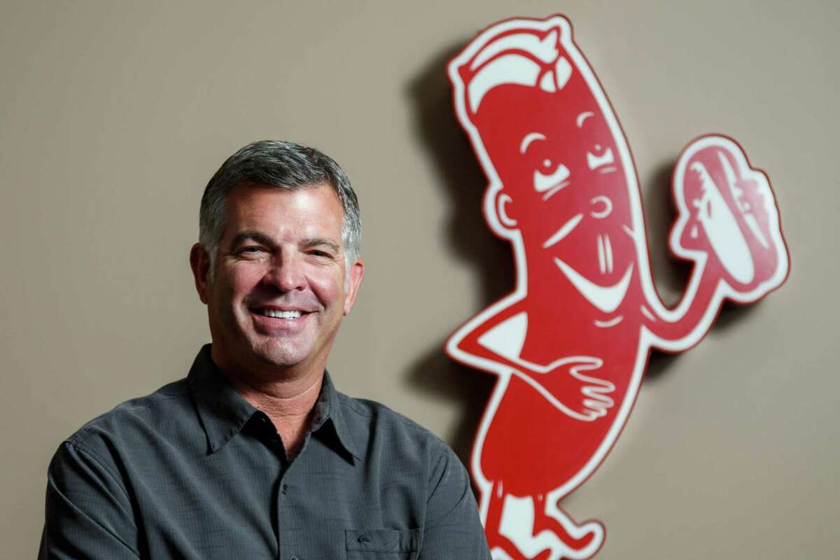 James Coney Island CEO Darrin Straughan poses for a photo at the restaurants' headquarters, Tuesday, June 18, 2013, in Houston. James Coney Island is celebrating its 90th anniversary this year and will soon announce several new concepts that will include more upscale restaurants modernizing the born-in-Houston hot dog chain. ( Michael Paulsen / Houston Chronicle )