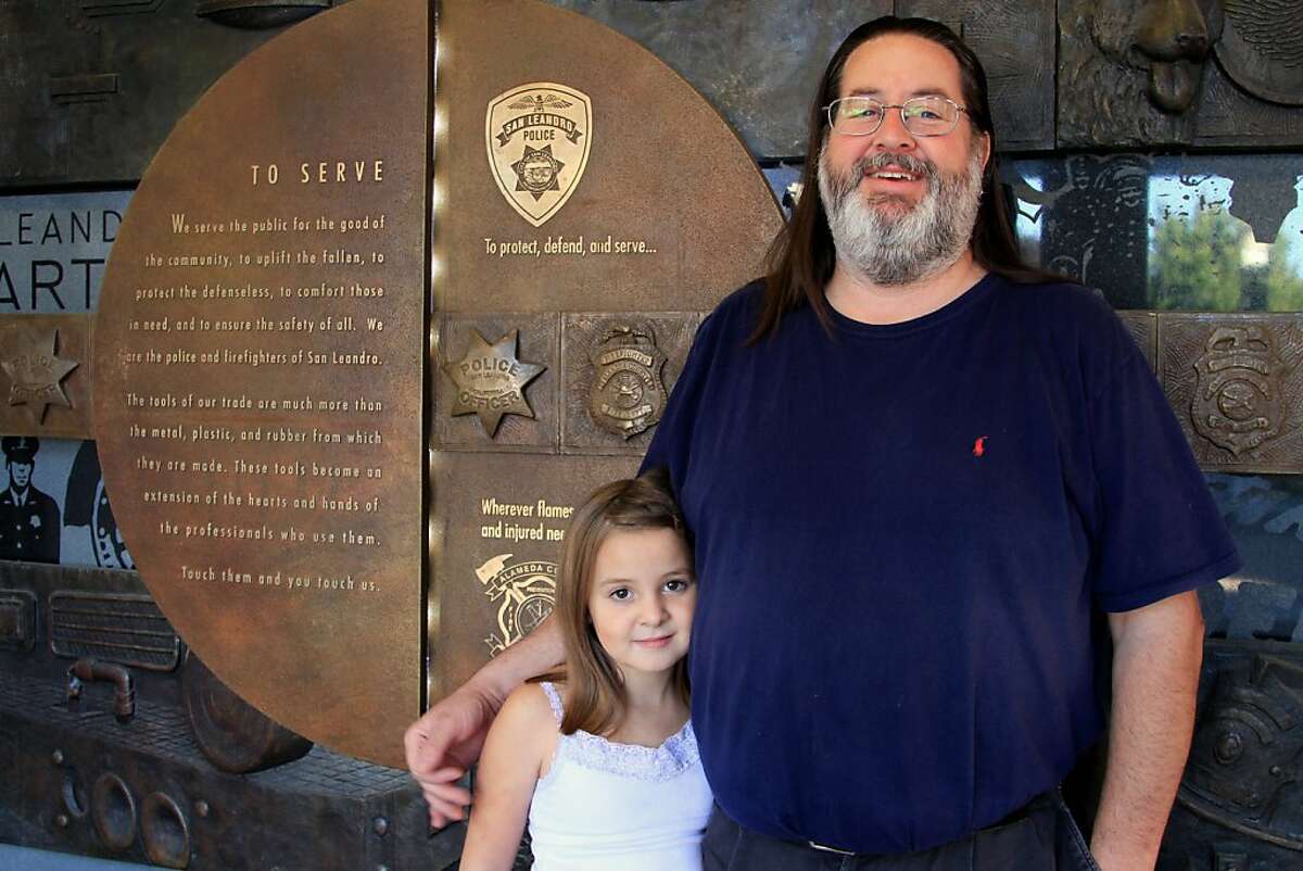 Mike Katz-Lacabe and his daughter Camila in front of the San Leandro Police Department station on 14th Street, San Leandro.