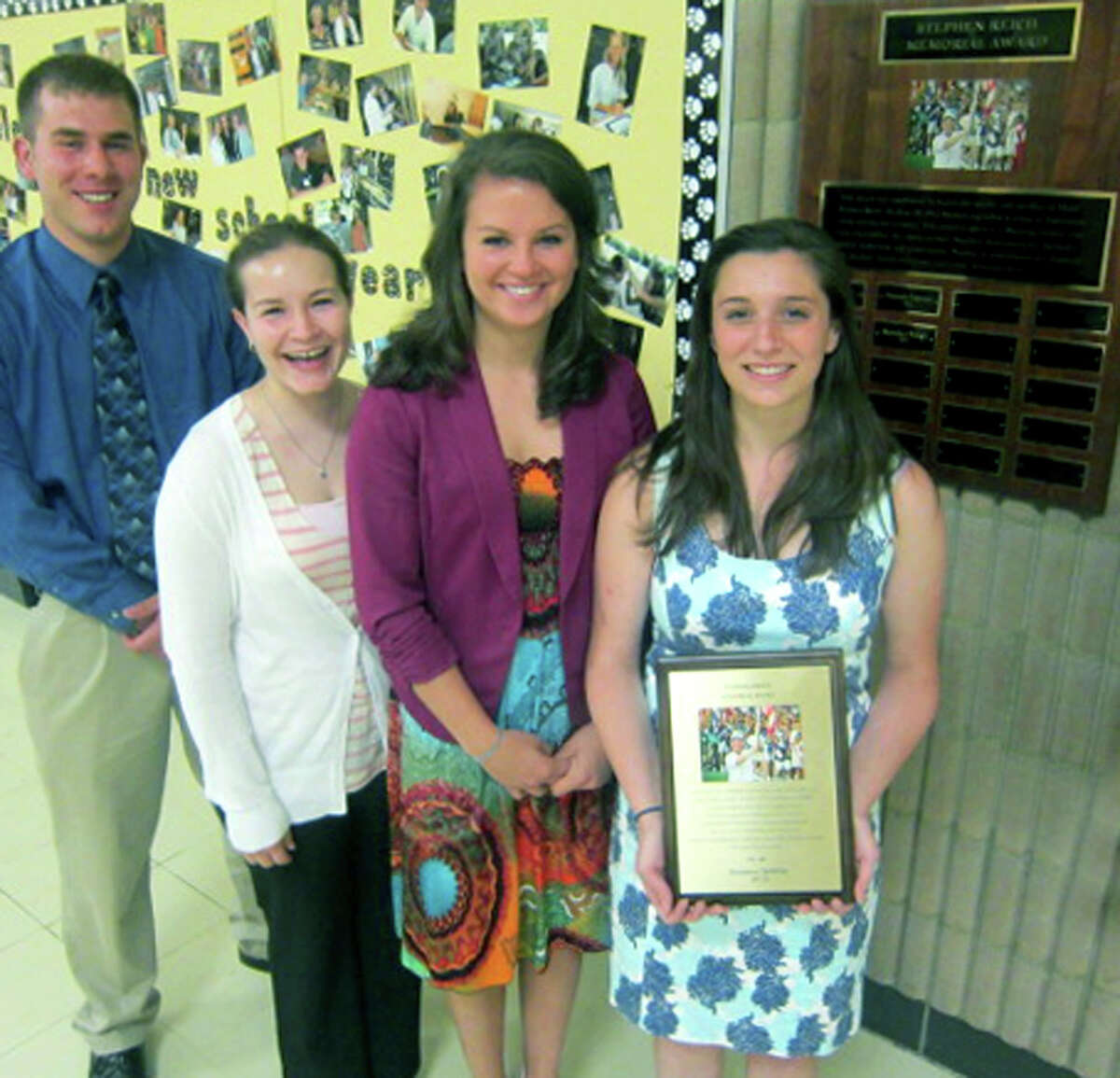 Kate DeWitte proudly holds the Stepehn Reich Memorial Award, given annually for eight years to a Shepaug Valley High School senior. Joining her following May 23's ceremony at the school are past recipients Ethan LaBella, Megan Woodruff and Alexandra Moravsky. May 23, 2013