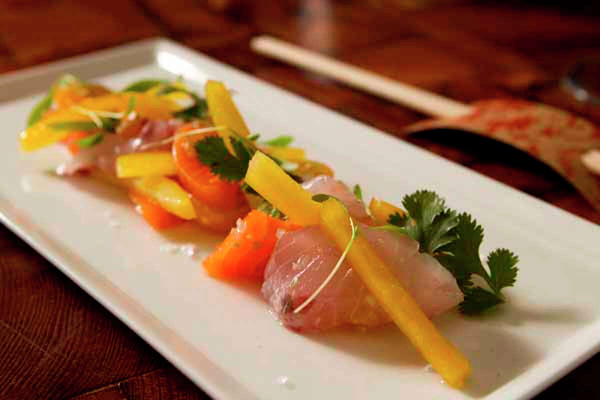 Uchiviche is salmon, striped bass, tomato, bell pepper, garlic and cilantro at Uchi.