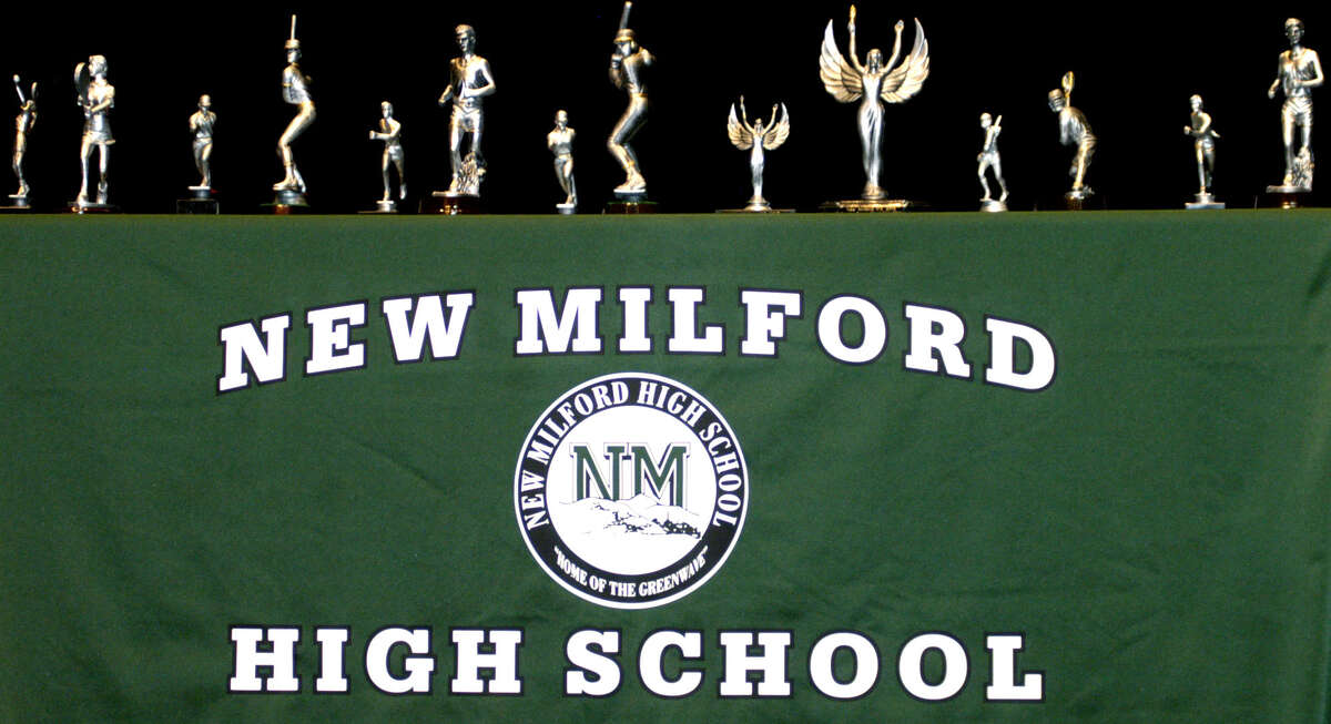 Trophies honoring standouts for the Green Wave's nine varsity teams are displayed at the start of the 2013 spring sports awards ceremony at New Milford High School. June 10, 2013