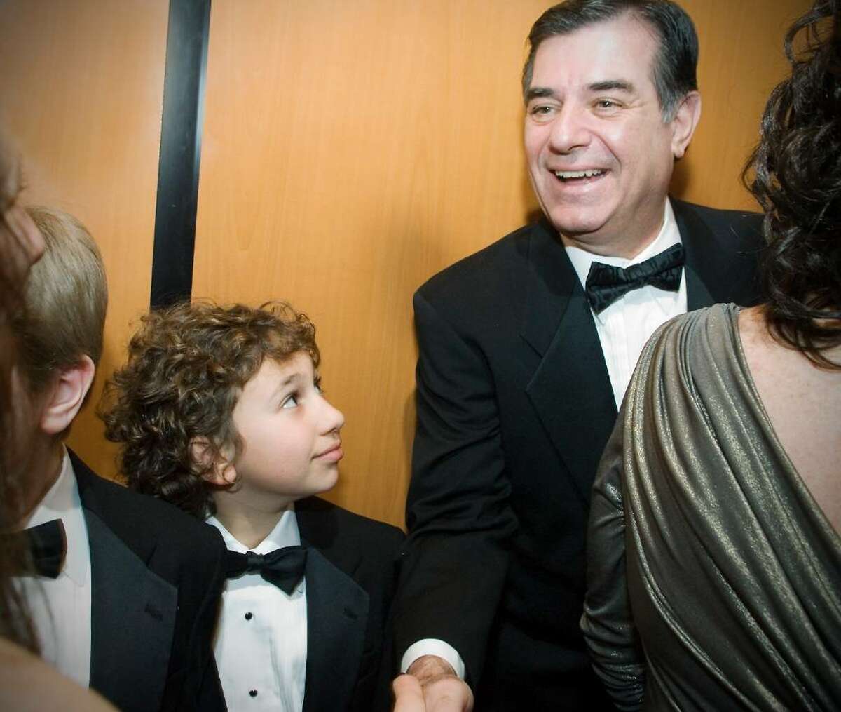 Mayor Pavia greets guests in the elevator as Evan Hyman, 10 of Stamford, jumps in for the ride at "A Thousand Stars Shine Together", A Gala Inaugural Celebration at The Palace Theater in Stamford, Conn. on Friday, January 15, 2009.