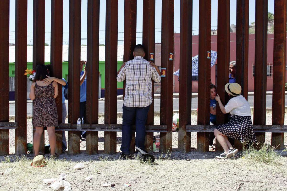 At a border fence in Arizona, three young immigrants are reunited with their parents, who were all deported. The parents traveled to the Mexican side of the fence from Brazil, Colombia and Guadalajara, Mexico, to see their children for the first time in many years.