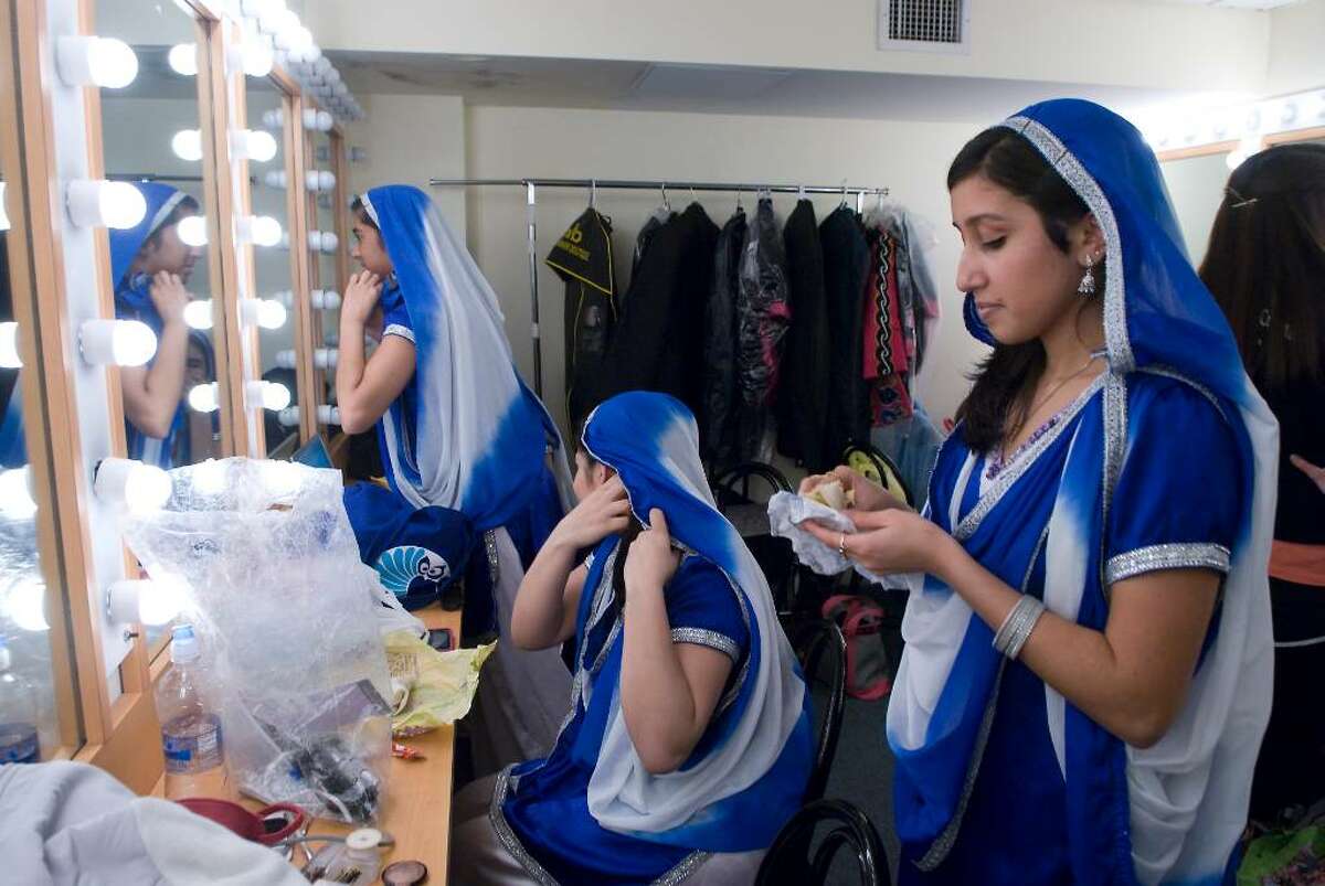 Members of the Husky Bhangro, dance troupe from UCONN Storrs, prepare backstage during the "A Thousand Stars Shine Together", A Gala Inagural Celebration at The Palace Theater in Stamford, Conn. on Friday, Jan. 15, 2010.