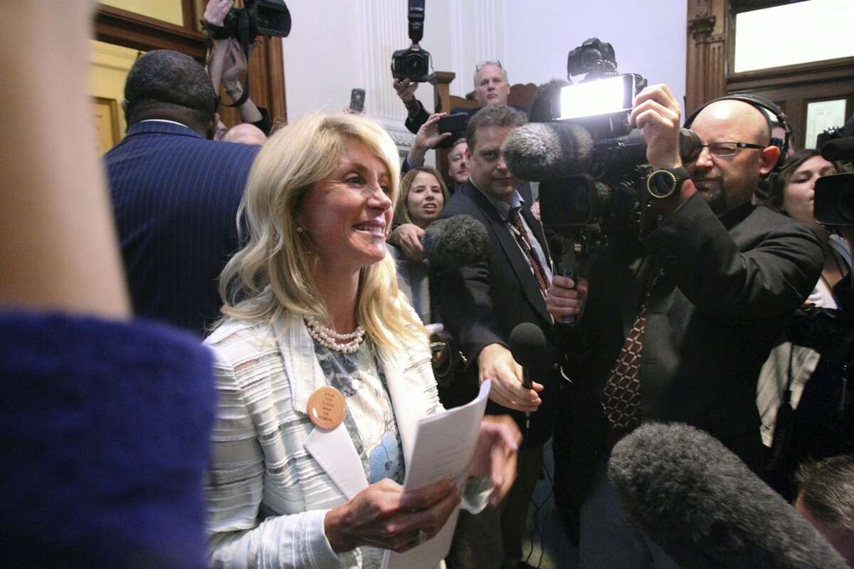 Fort Worth Senator Wendy Davis makes an appearance outside the Senate Chamber after she filibusters in an effort to cause abortion legislation to die without a vote on the floor of the Senate Tuesday, June 25, 2013.