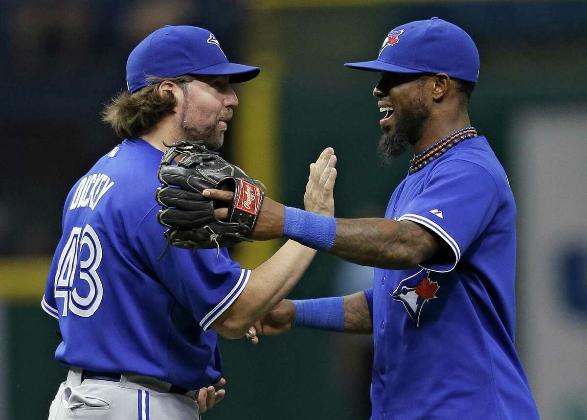 R.A. Dickey, left, and Jose Reyes were all smiles Tuesday, as the former notched his first shutout of the year and the latter played for the first time in two months.