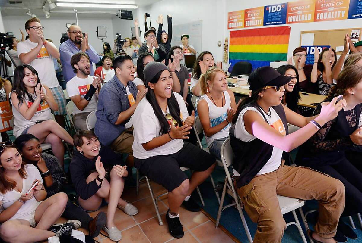 WEST HOLLYWOOD, CA - JUNE 26: Martha Acevedo (C), 25, reacts with other to the Supreme Court ruling at a watch party at Equality California, a non-profit civil rights organization that advocates for the rights of LGBT people in California, on June 26, 2013 in West Hollywood, California. The high court struck down the Defense of Marriage Act (DOMA) and ruled that supporters of California's ban on gay marriage, Proposition 8, could not defend it before the Supreme Court. (Photo by Kevork Djansezian/Getty Images)