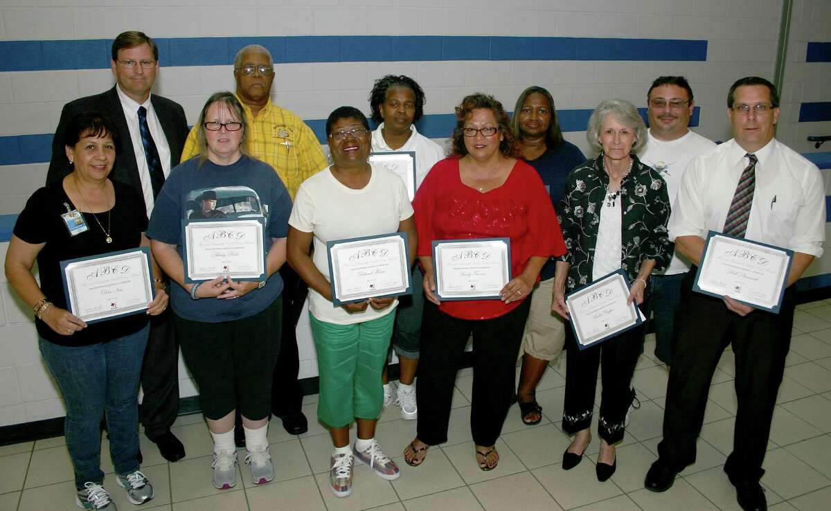 Spring Independent School District transportation employees display their Above and Beyond the Call of Duty awards. Front row, from left, are Dora Nora, Shirley Briles, Deborah Harris, Sandy Trevino, Andrea Crafton and Bill Starmack. Back row, from left,