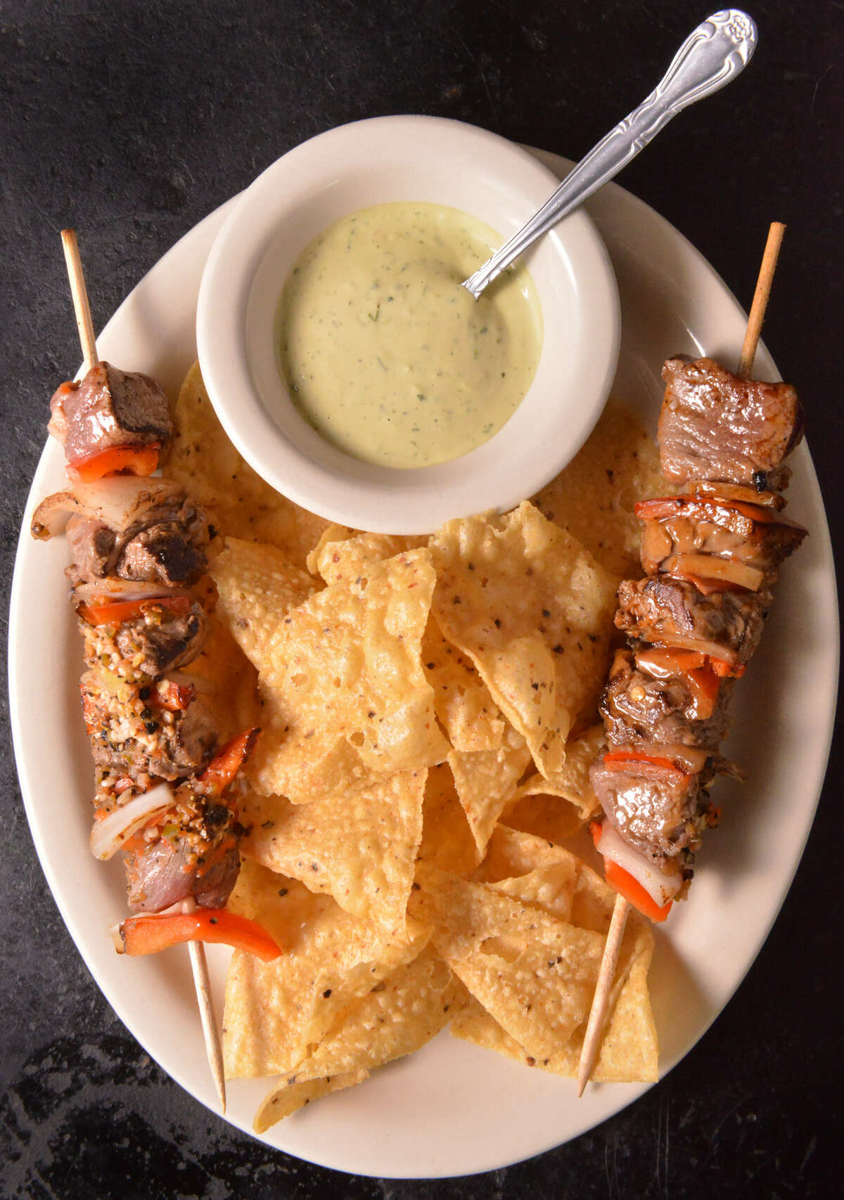 Anticuchos — a favorite during Fiesta — are among the café's best dishes, year-round.