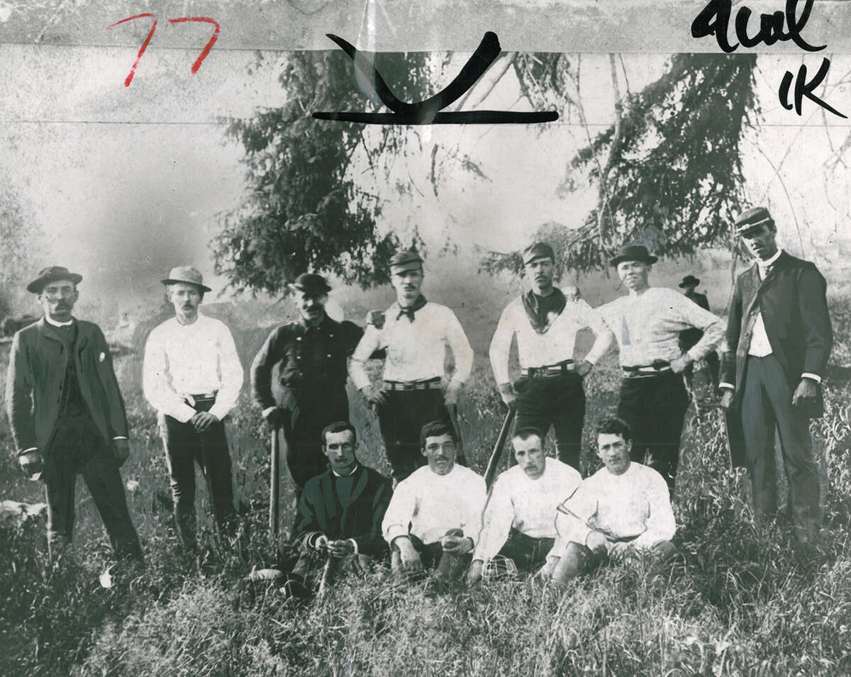 This is the oldest known photograph of a Seattle baseball team. The very first team, known as the Alkis, was put together in 1876. But this photo is of the Seattle Reds, the champions of Washington Territory. Our archival photo caption reads: "As you see, they were not completely uniformed when the photograph was taken in 1884. Their sworn enemies were the Willamettes, the Oregon champions. In 1886 they toured the Pacific Northwest."