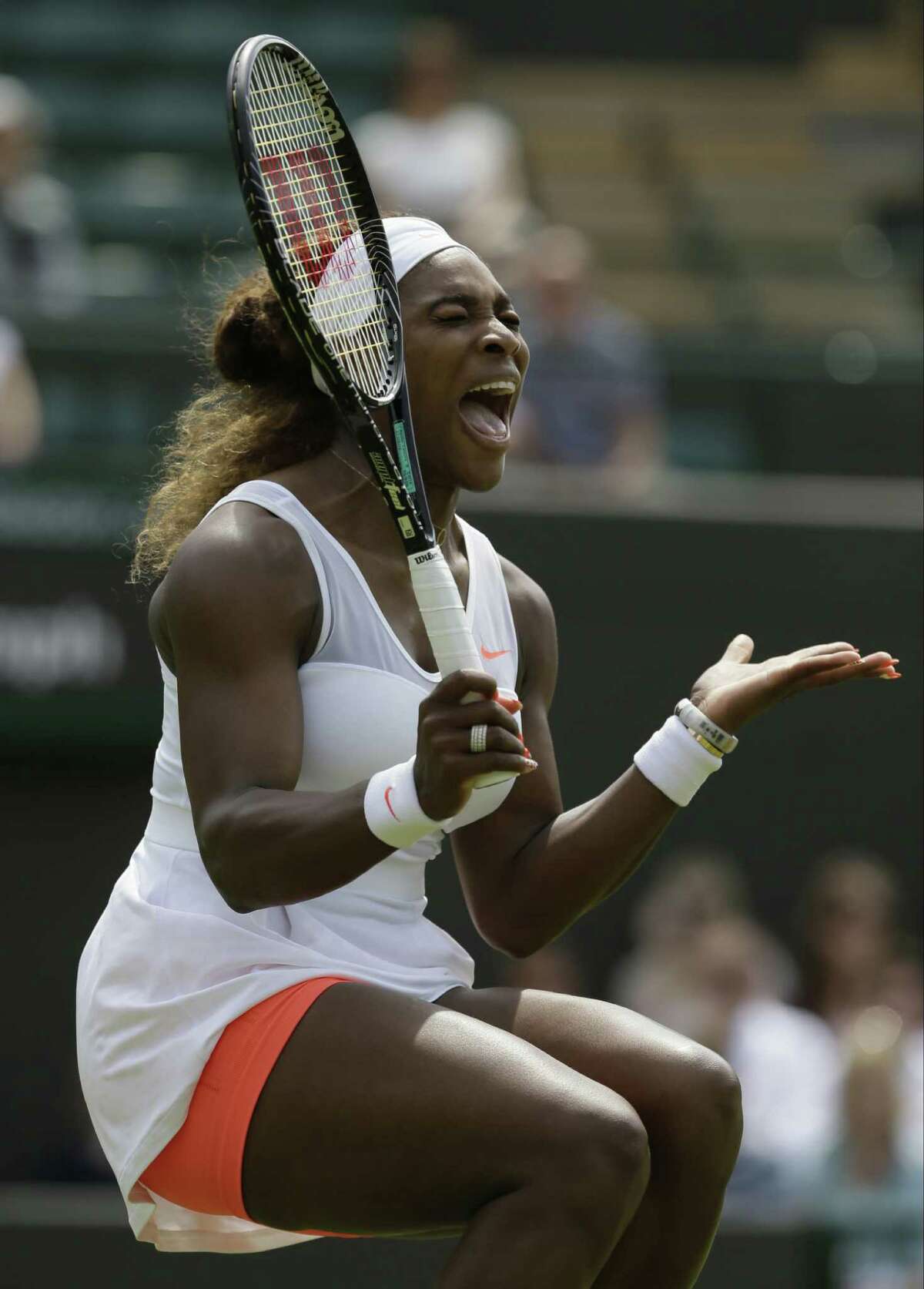 Serena Williams rejoices after winning a point against 100th-ranked qualifier Caroline Garcia during her 6-3, 6-2 second-round victory at Wimbledon.