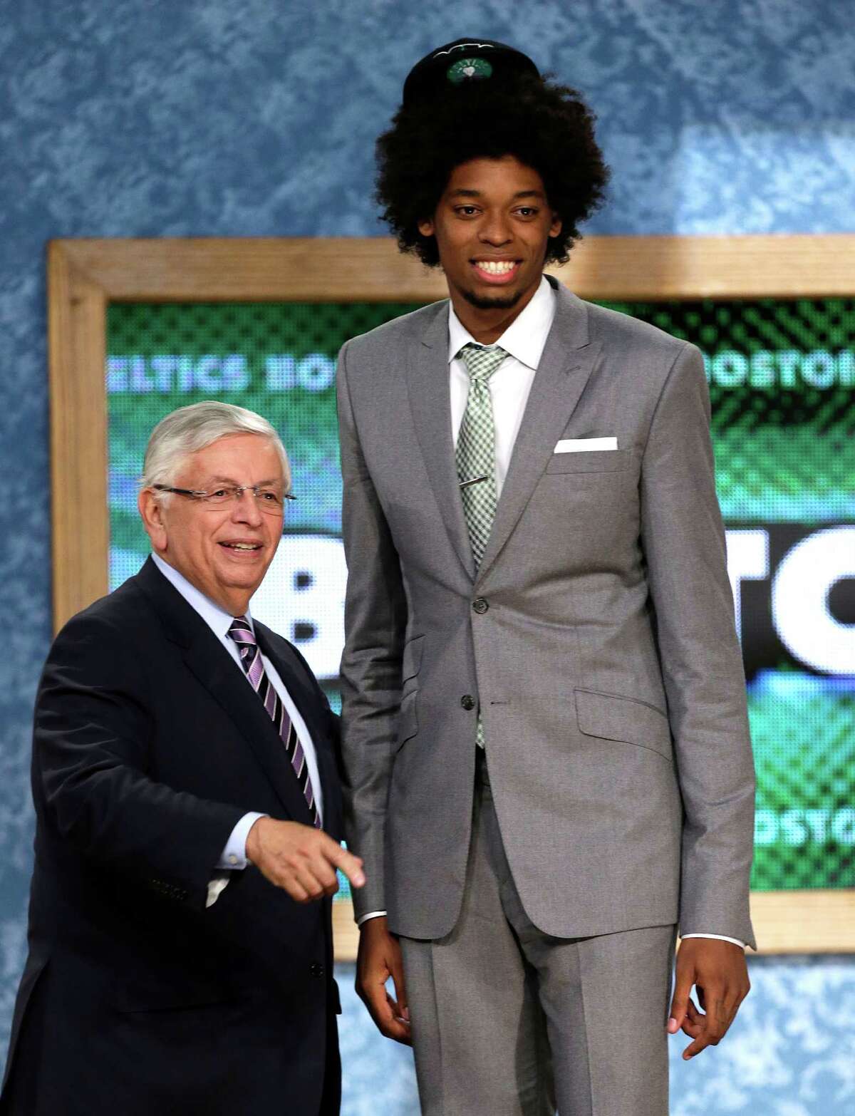 NBA Commissioner David Stern, left, stands with Lucas Nogueira, of Brazil, who was selected by the Boston Celtics in the first round of the NBA basketball draft, Thursday, June 27, 2013, in New York. (AP Photo/Kathy Willens) ORG XMIT: NYKW130