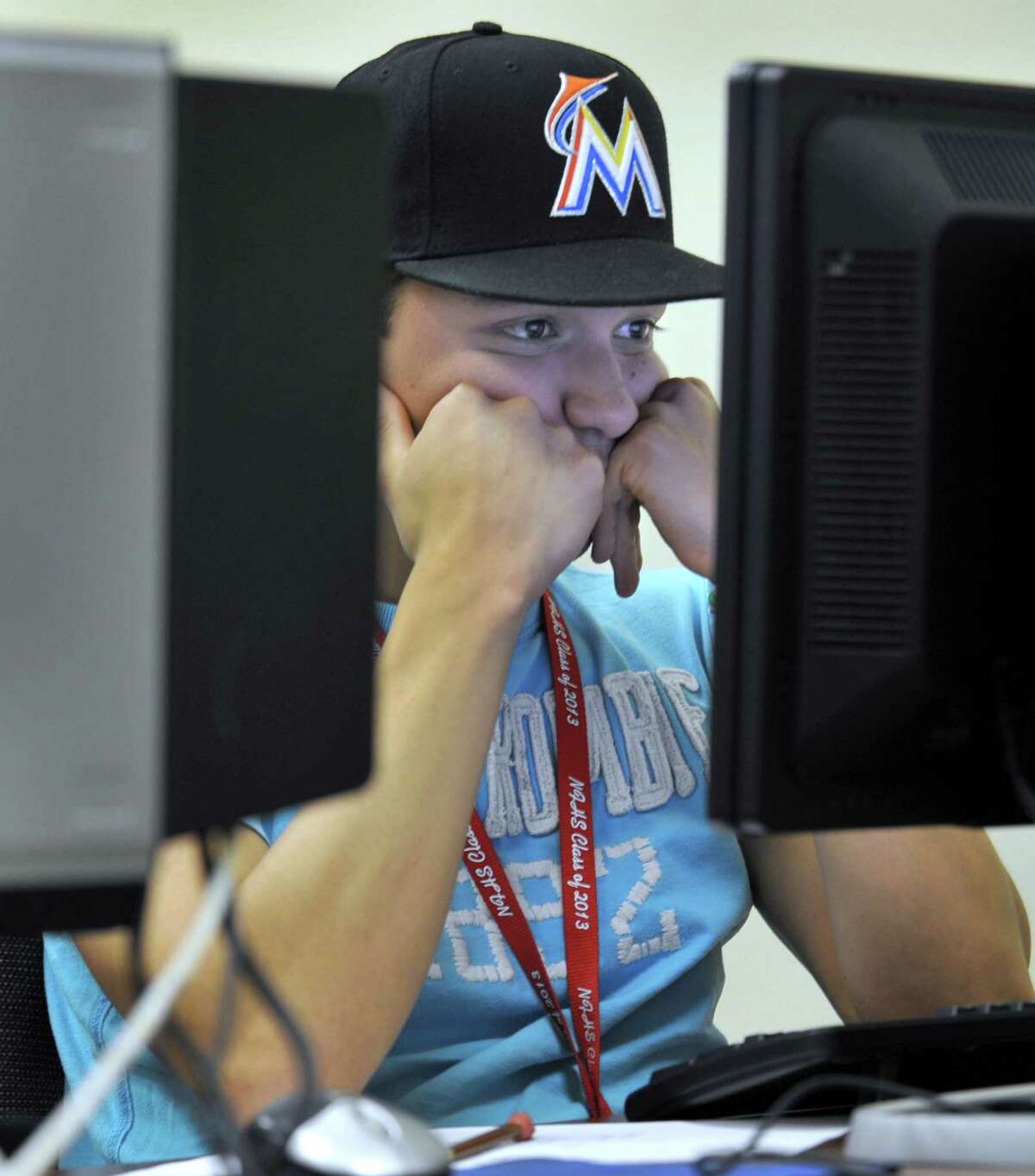 George Tacuri, 18, of New Fairfield, takes a placement test for admission to Naugatuck Valley Community College Friday, June 28, 2013 at the school's Main Street Danbury facility. The college has permission to grant associate degrees and to triple its space in Danbury, Conn.