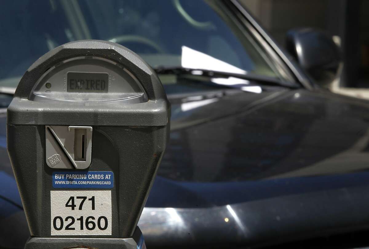 A parking ticket is left on a car parked at an expired meter on Harrison Street in San Francisco, Calif. on Friday, June 28, 2013. The violation for parking at expired meters jumps to $74 on July 1, making it the most expensive fine in the country.