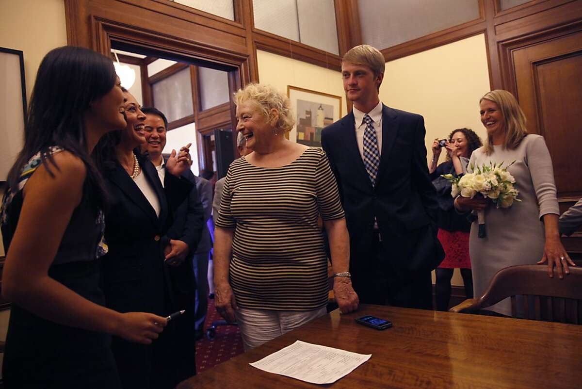 Harris refused to uphold Prop. 8 even though it was her job As Attorney General of California, it was Harris' job to uphold the laws of the land, but there was one law that she refused to uphold. That was Proposition 8, the California ballot measure that (for a while) eliminated the right for same-sex couples to marry. Harris, second from left, congratulates the lead plaintiff in the Proposition 8 test case Sandy Stierge, right, on her marriage to Kris Perry, not shown, in the mayor's office in San Francisco in this file photo from Friday, June 28, 2013. Laura Hubbard, Kris Perry's mom, and the couple's son Elliot Perry are in the middle.