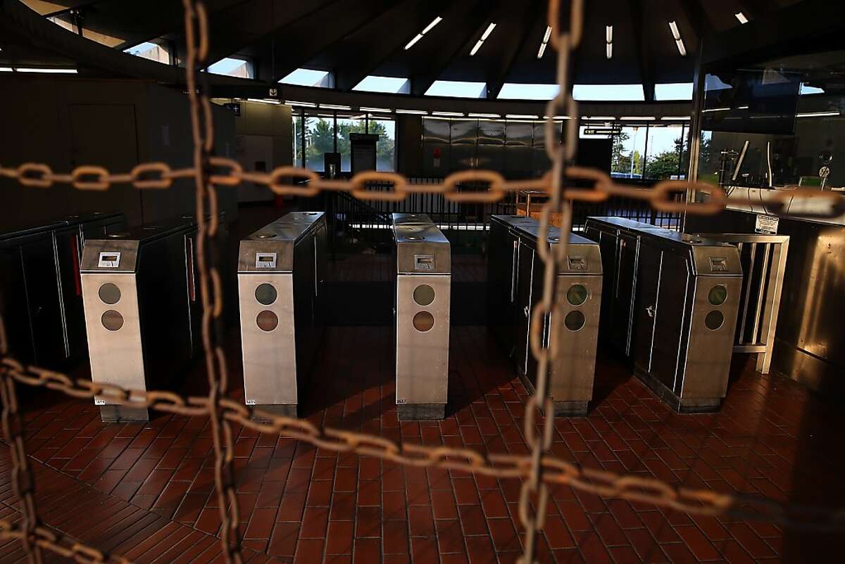 Pay gates sit empty at the North Berkeley BART station on Monday.