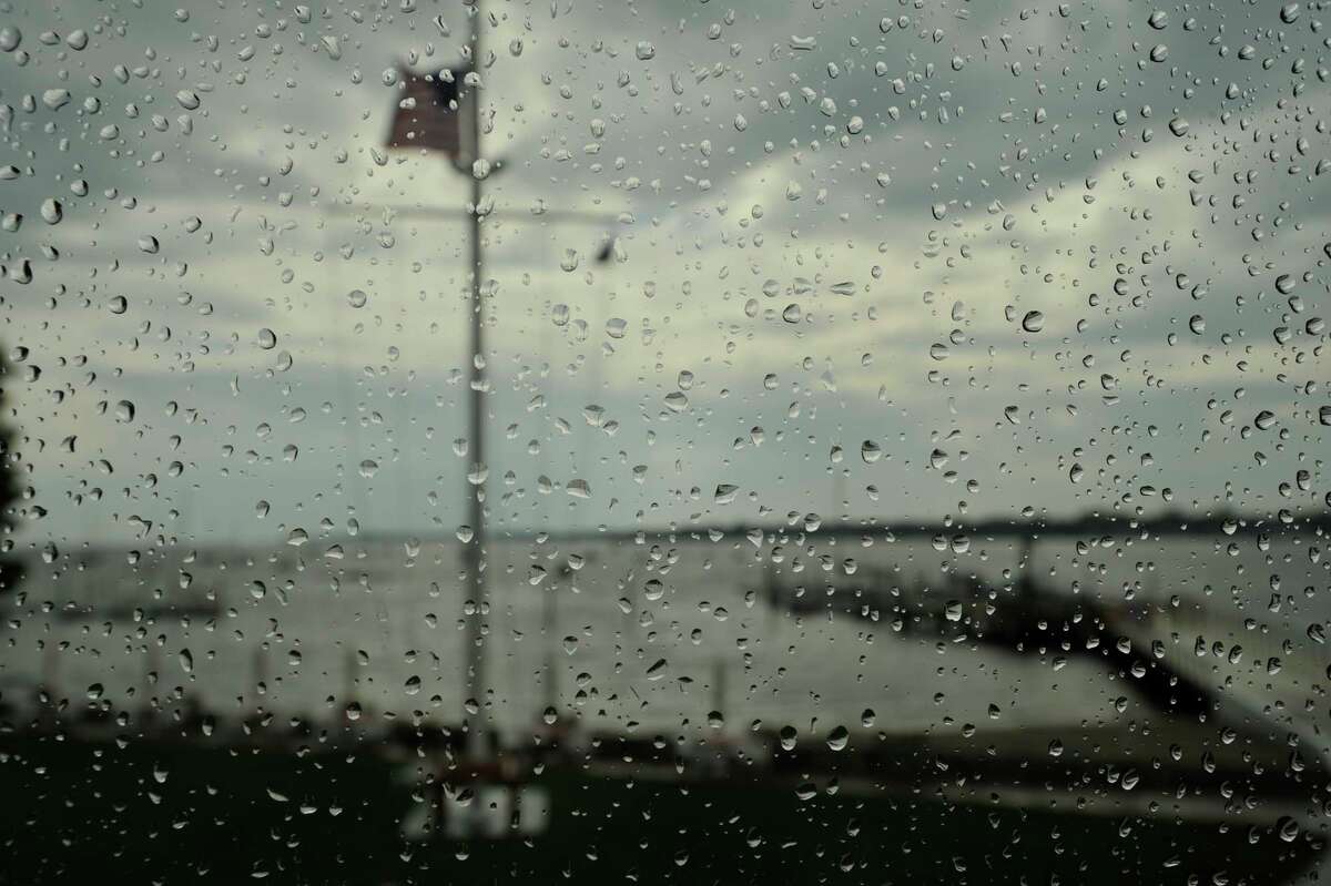 Raindrops cling to the window of the Stamford Yacht Club on Tuesday, June 11, 2013. There has been record-setting rain so far this year in Stamford, Conn.