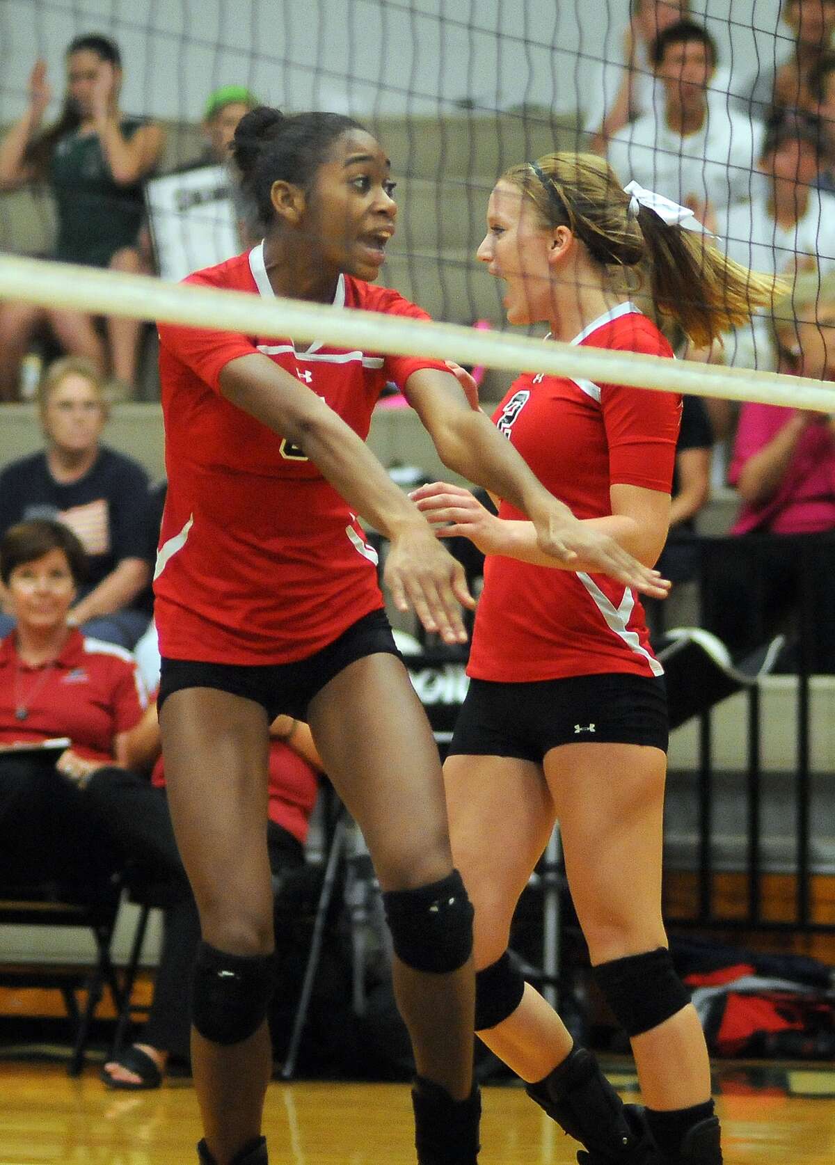 Porter again will feature junior middle blocker Sydney Williams, left, who celebrated with outside hitter Jenny Shaw last year. Shaw graduated in May.