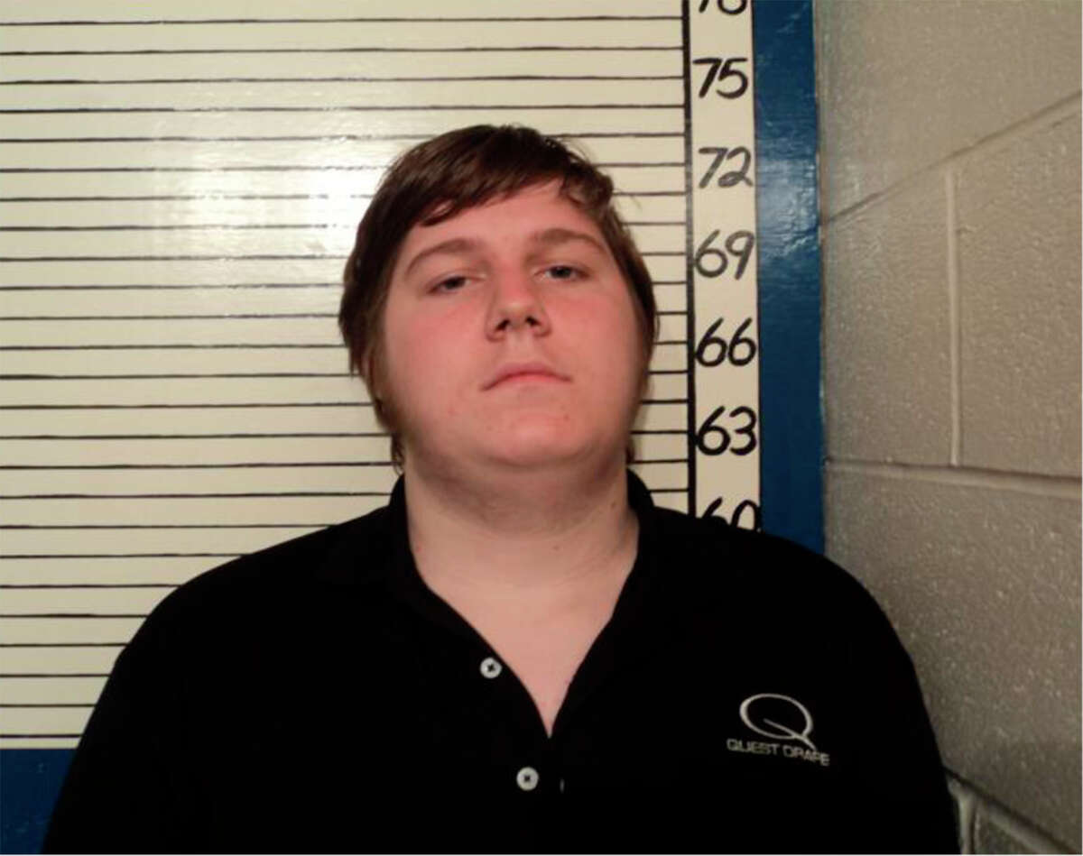 Justin River Carter, 19 has been locked up since March on a terroristic threat charge over the facebook post that he says, in a jailhouse letter to the judge, was a misguided attempt at humor. "I was trying to be witty and sarcastic. I failed and I was arrested."