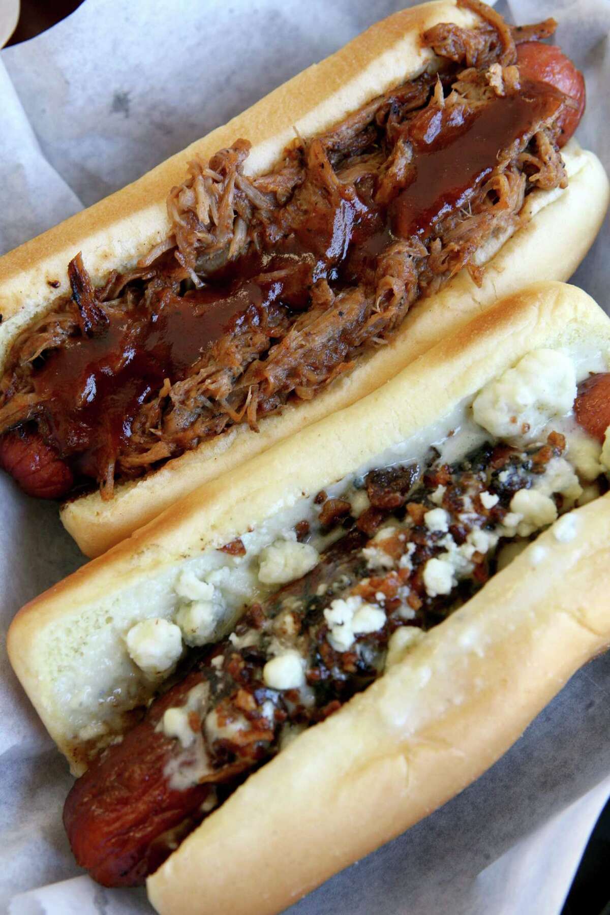 The pork dog (top) and the SA dog are served at the Original San Antonio Hot Dog House, which won Readers' Choice Best Hot Dog.