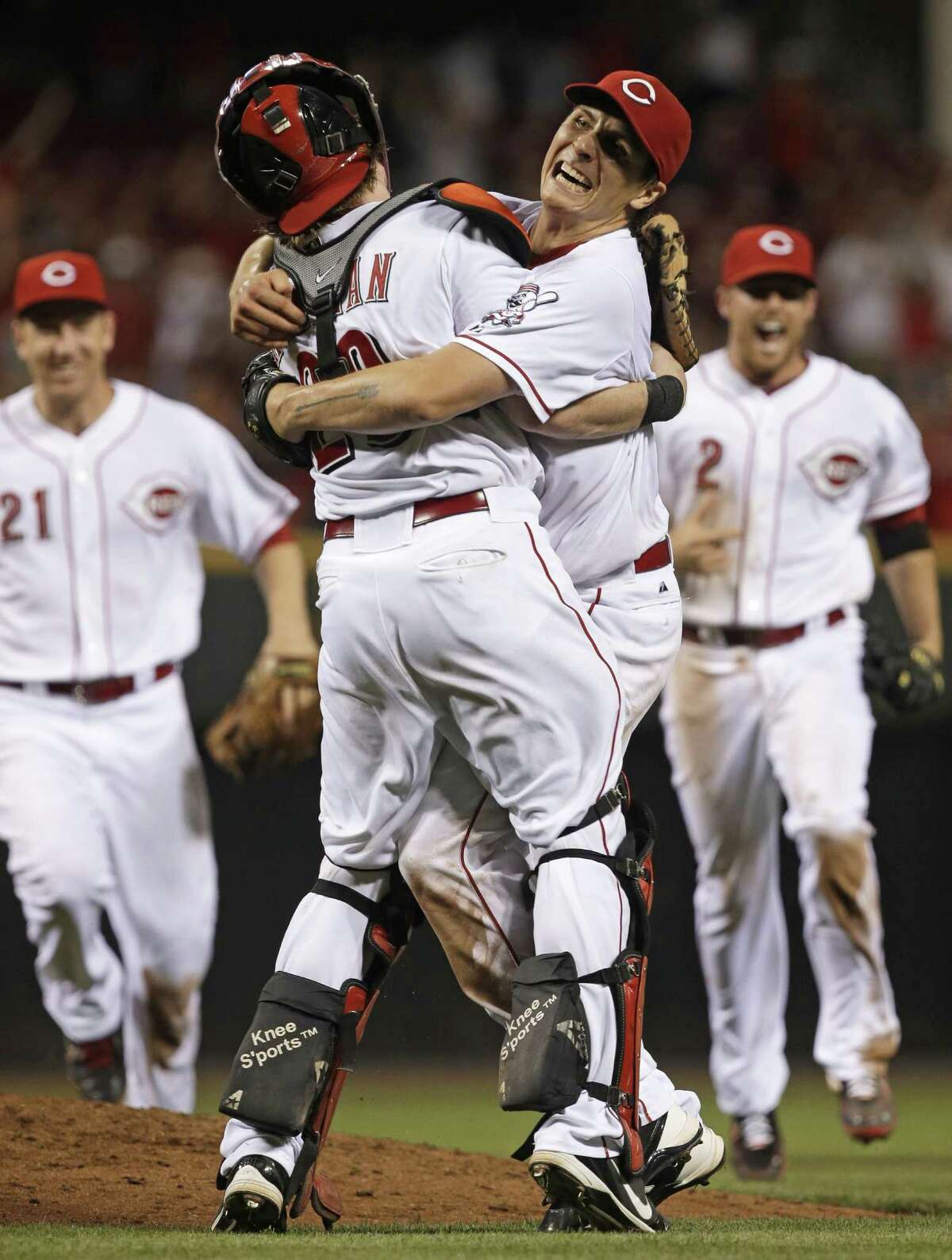 Reds pitcher Homer Bailey (right), a La Grange native, hugs catcher Ryan Hanigan after finishing off his second career no-hitter. The other came last September in Pittsburgh.