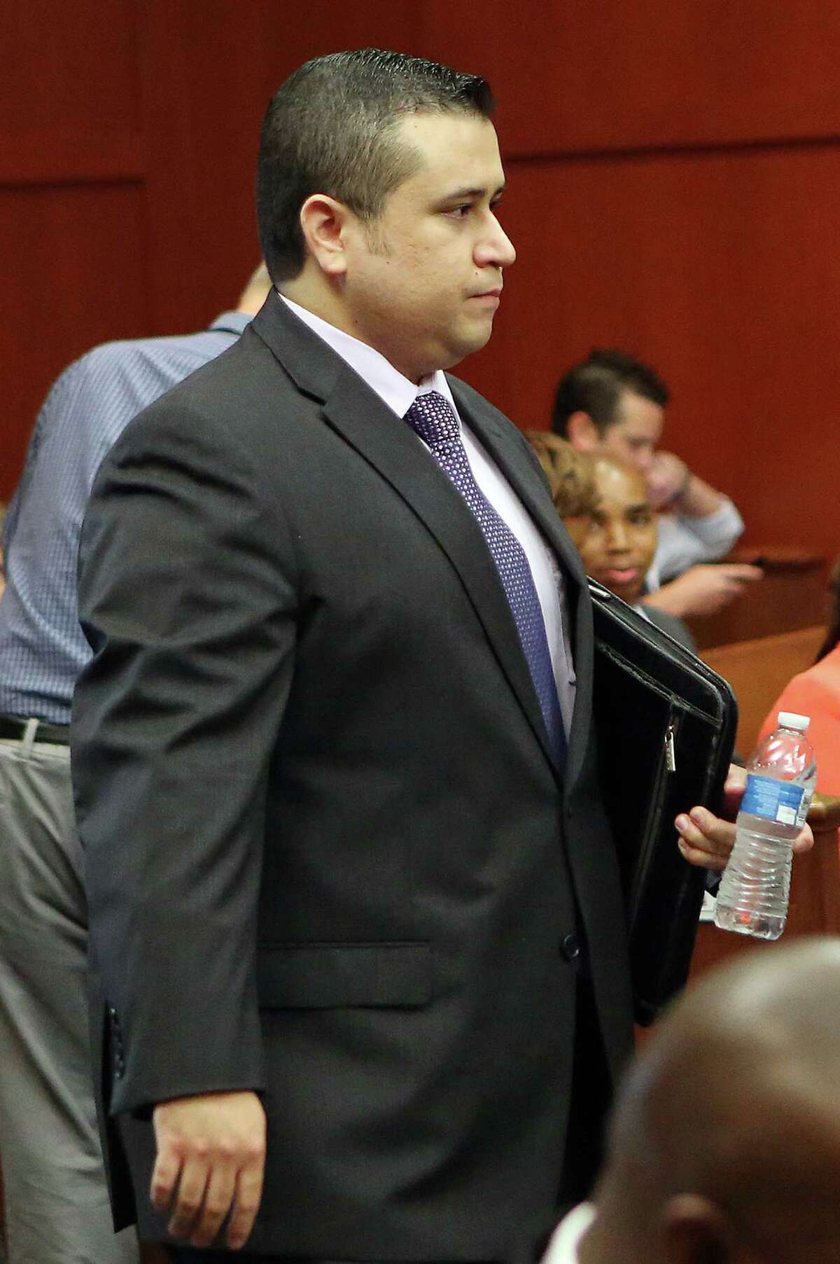 George Zimmerman enters the courtroom at his trial in Seminole County circuit court, in Sanford, Fla., Wednesday, July 3, 2013. Zimmerman is charged with second-degree murder in the fatal shooting of Trayvon Martin, an unarmed teen, in 2012. (AP Photo/Orlando Sentinel, Jacob Langston, Pool)