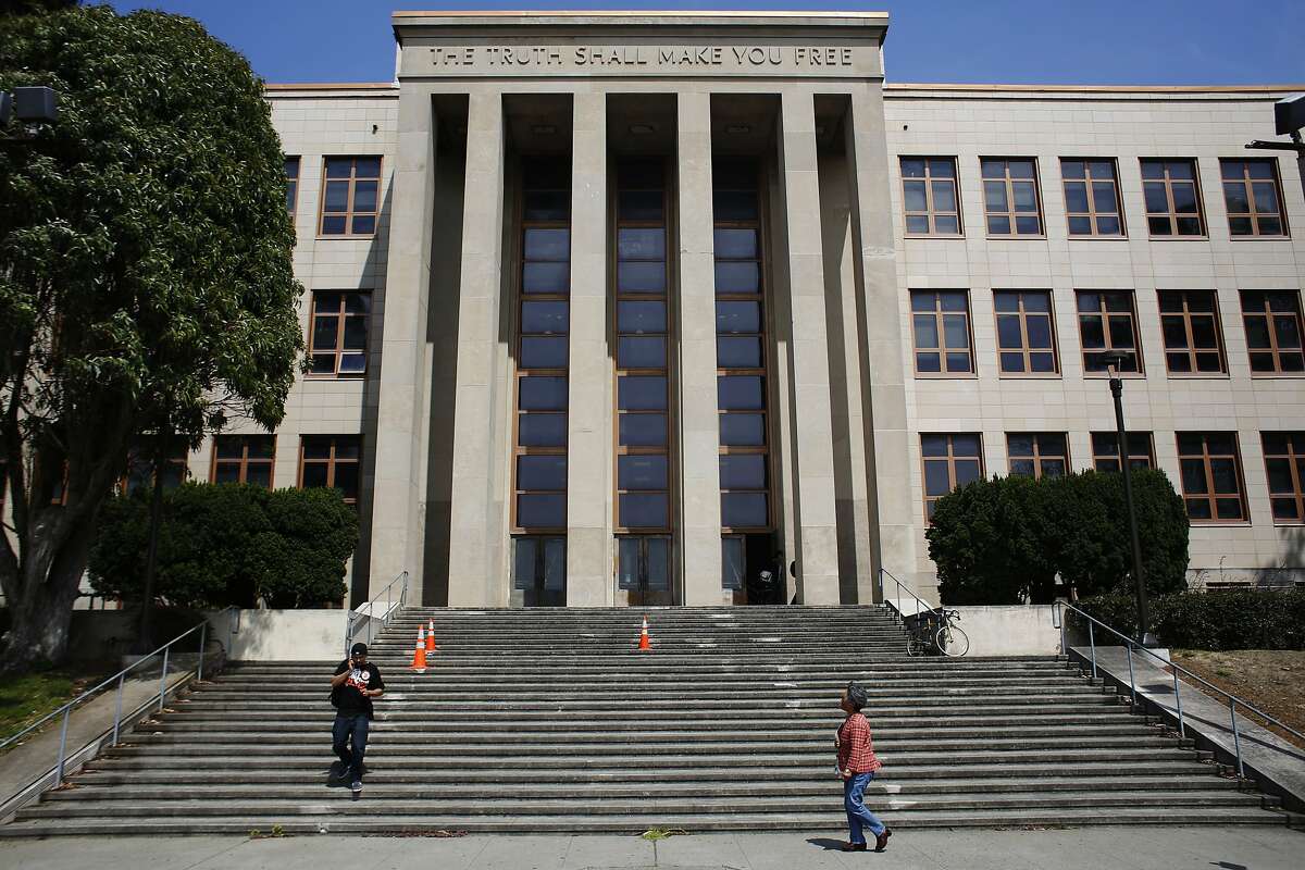 Students walk down the steps of a building at the City College of San Francisco on July 3, 2013.