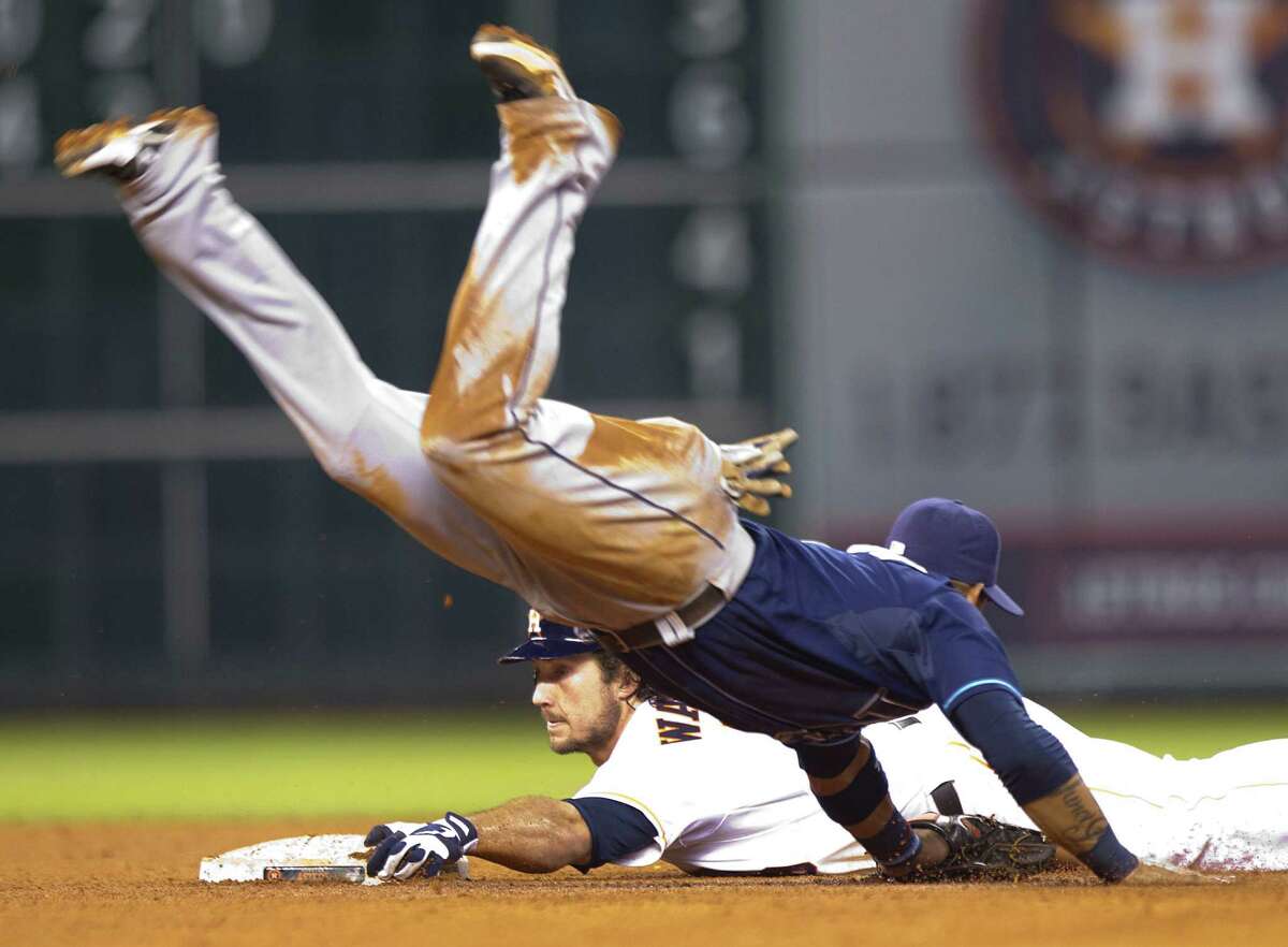 Brett Wallace gets the Astros' three-run seventh inning started with a double that included a nice slide to avoid the sprawling tag by Rays shortstop Yunel Escobar.