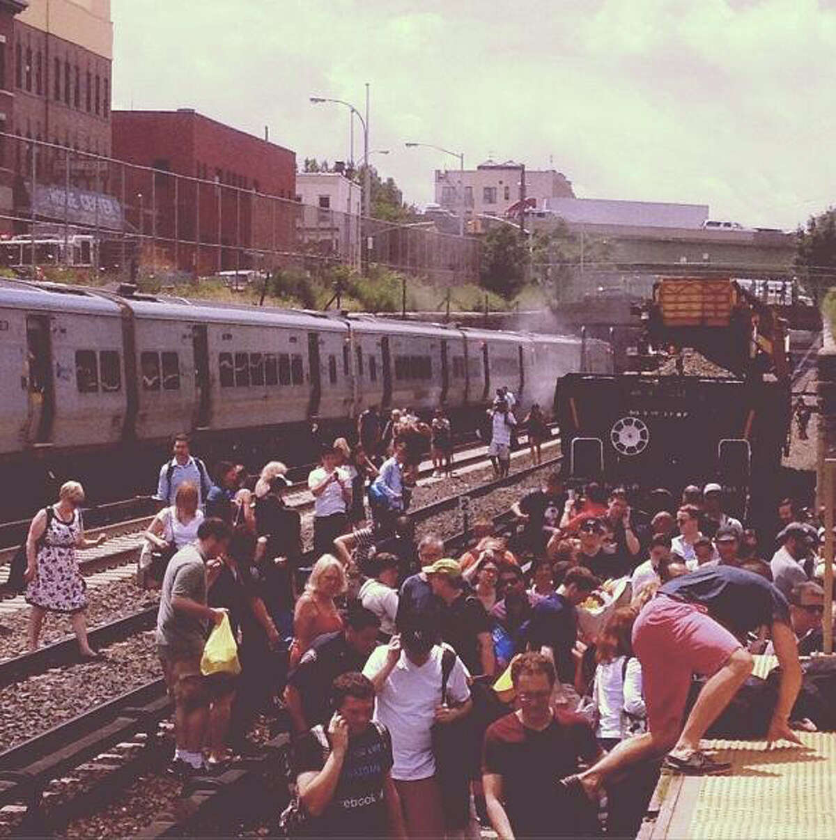 Passengers evacuated from a Metro-North commuter train after a fire was reported on the rear car Thursday, July 4, 2013. No injuries were reported, but service along the New Haven Line has been suspended indefinitely.