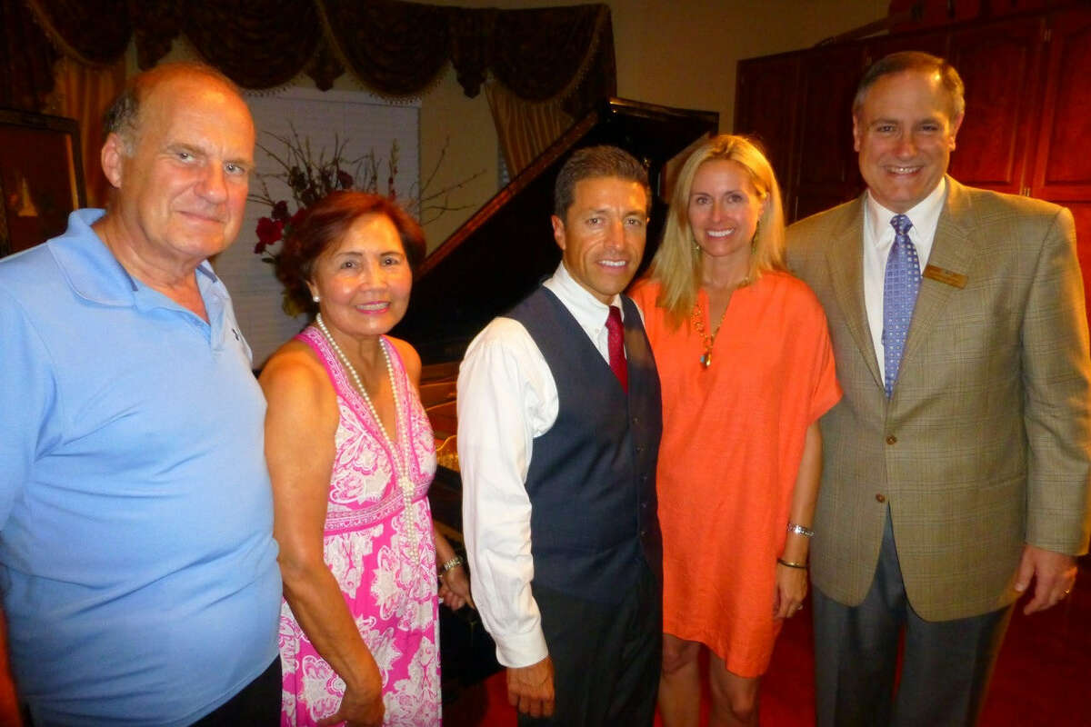 Dr. Peter Petroff and wife Rose Petroff (from left), visit with pianist Gustavo Romero, Christina Meyer and Board Chairman Jim Lucas at a private concert at their home presented by the San Antonio International Piano Competition.