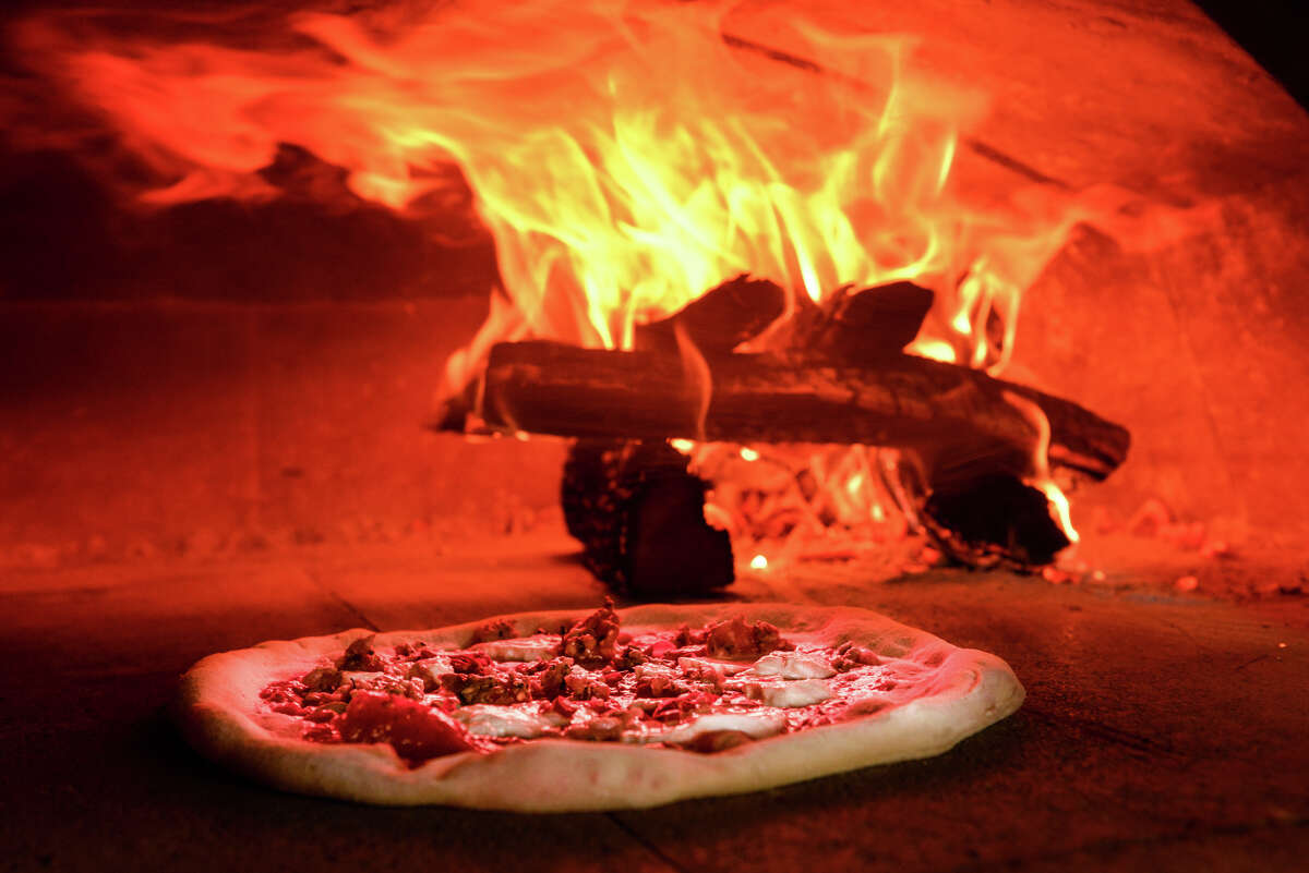 The Spicy Italian Fennel Sausage Pizza is cooked in a wood fire oven at the Stella Public House in the Blue Star Arts Complex.