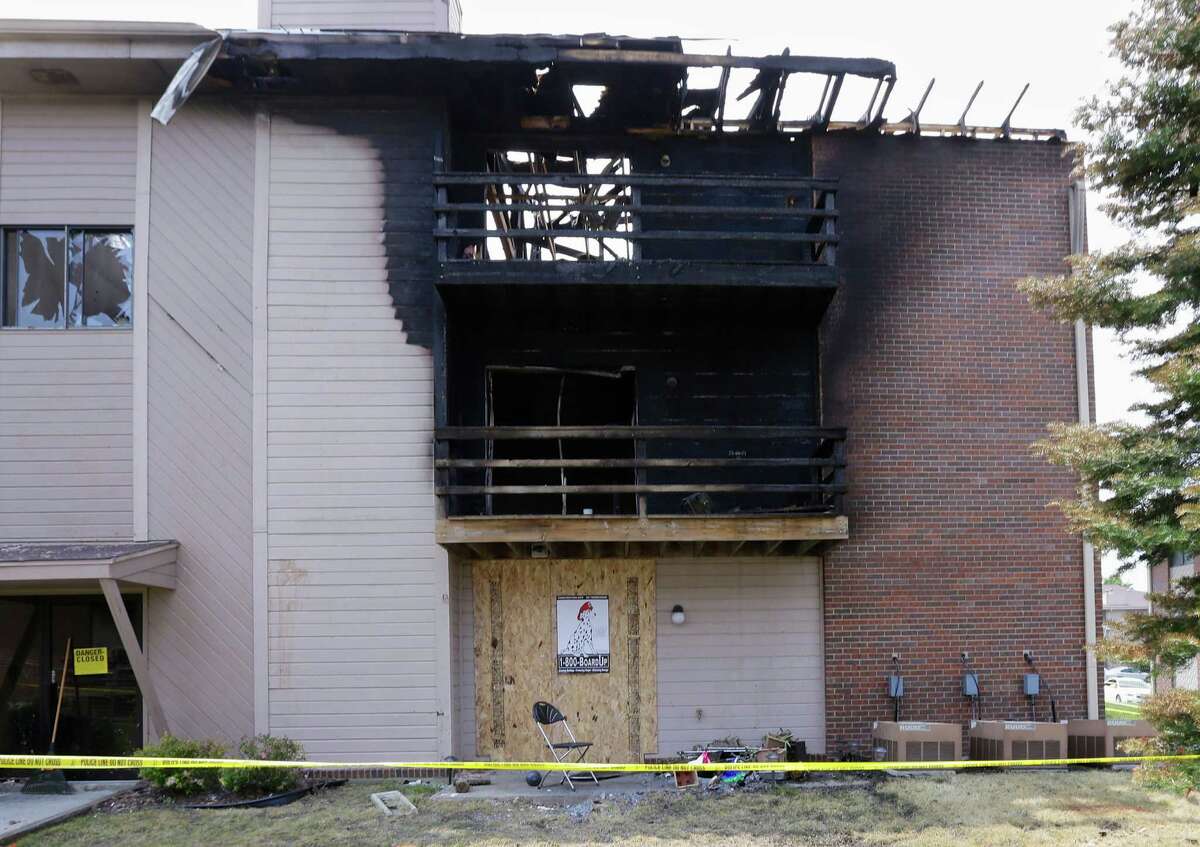 The burnt Applewood Point apartment complex is seen in Omaha, Neb., Tuesday, July 2, 2013. Assistant Fire Chief Dan Stolinski said a cigarette stubbed out in potting soil on the second-floor balcony deck reignited and set fire to the potting soil and to the apartment complex, Friday, June 28. The fire forced about 80 people to evacuate and took more than three hours to be extinguished. (AP Photo/Nati Harnik)