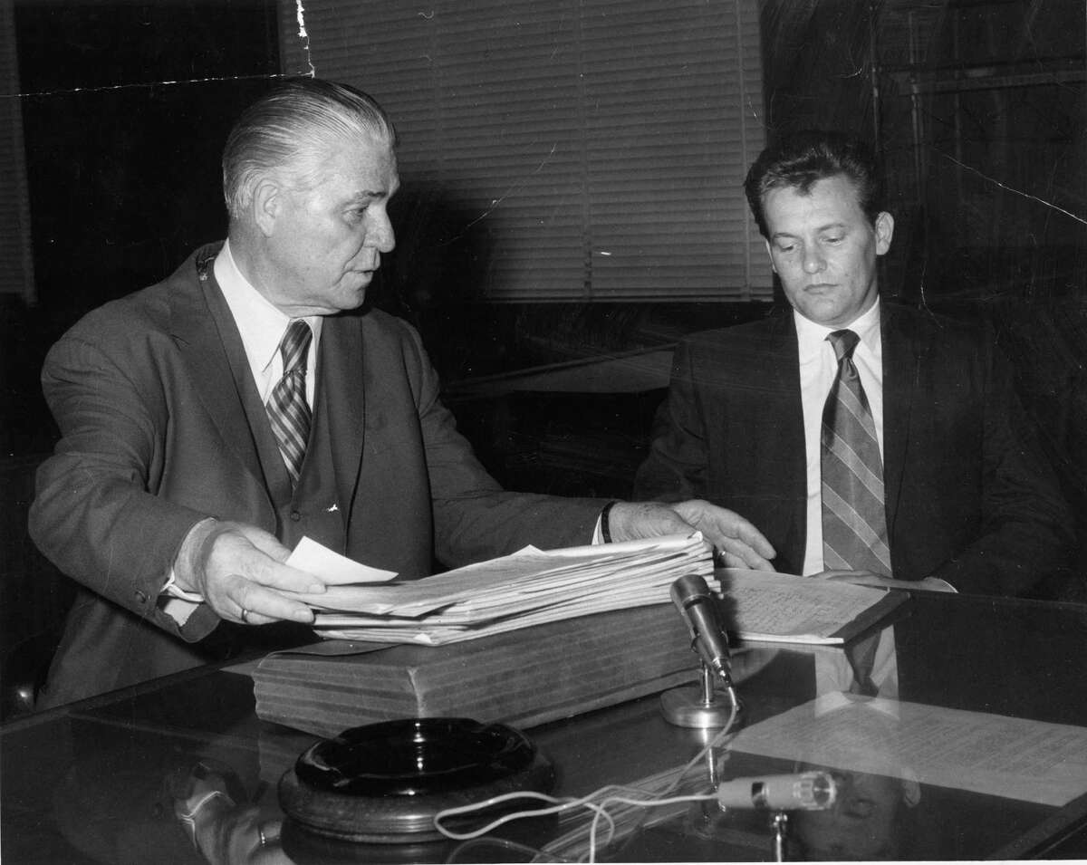 07/08/1970 - Charles V. Harrelson, right, confers with his attorney Percy Foreman. Harrelson is accused in the murder of Houston carpet executive Alan Harry Berg.