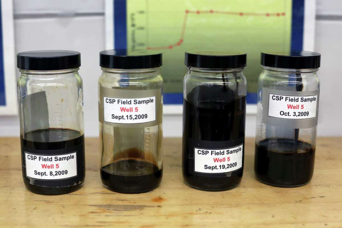 Samples of bitumen, a gooey mix of clay, sand and crude oil that must be strip mined or steamed and pumped out of the ground, at Imperial Oil's research center in Calgary, Alberta, Canada, June 10, 2013. Anticipating new criteria for approval of the Keystone XL pipeline from President Barack Obama, Canadian oil companies have embarked on a race to develop cleaner technologies that will make their production less damaging to the environment.