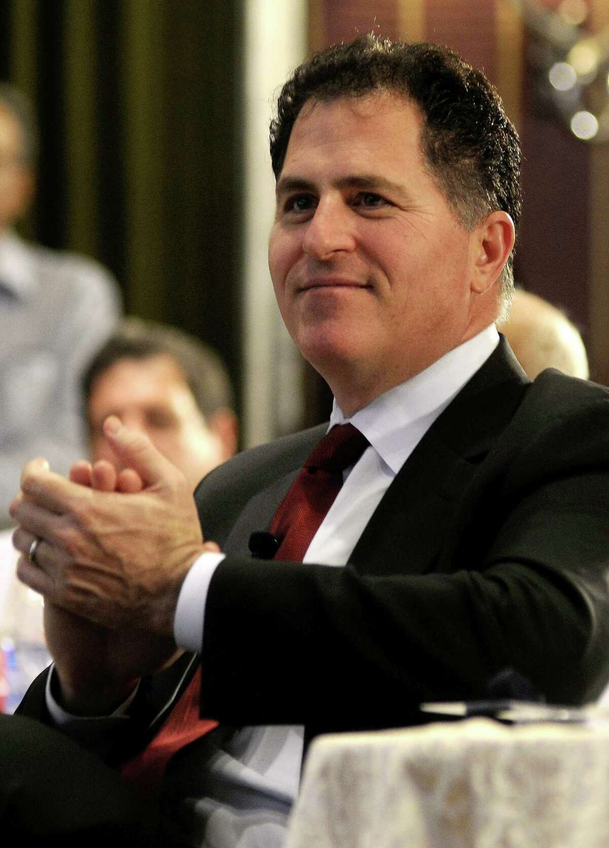 (FILES) CEO of Dell Inc, Michael Dell applauds after a speaker's address while taking part in an interactive session organised by the Confederation of Indian Industries (CII) in Bangalore in this Januray 9, 2012 file photo. A special committee of Dell's board studying a sale of the computer giant said June 5, 2013 the alternative plan from corporate raider Carl Icahn is underfunded by as much as $3.9 billion. The panel, which has set a shareholder vote for July 18, offered a detailed explanation of its support for a private equity buyout led by company founder Michael Dell worth $24.4 billion. In a statement and a a regulatory filing, the panel said the private equity deal "is the best option for shareholders, including the superior value and certainty it provides relative to all alternatives evaluated and its shifting of Dell's business risks to the buyer group." AFP PHOTO/STRSTRDEL/AFP/Getty Images