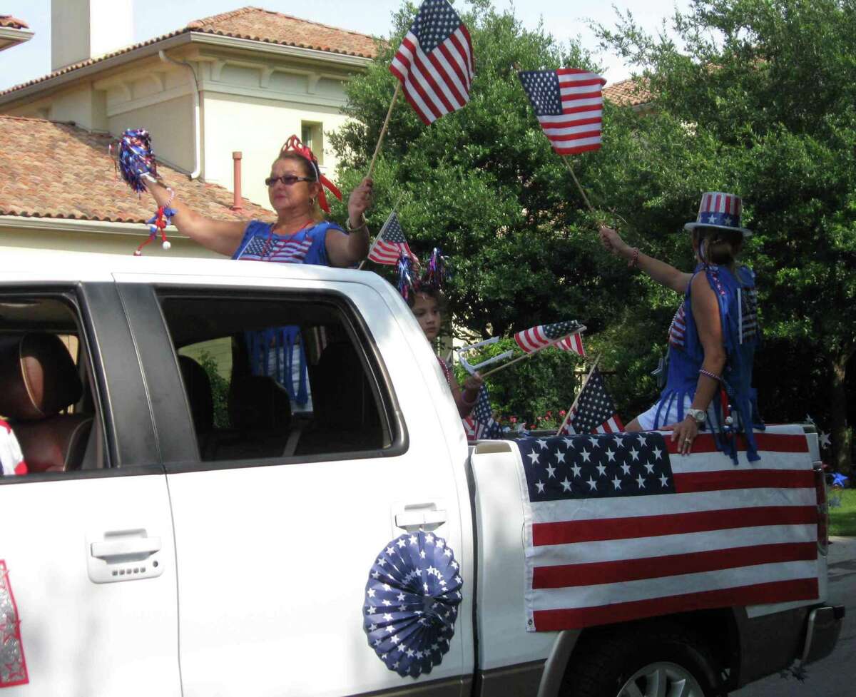 Terrell Hills residents show off their patriotic spirit during the city's Fourth of July parade, which was followed by a picnic on Geneseo Parkway.