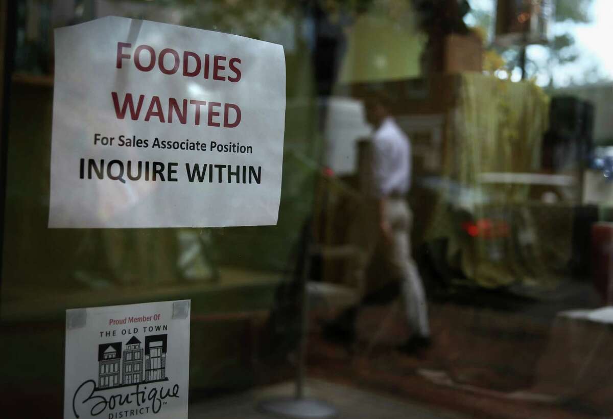 A hiring sign was up Friday in the Old Town section of Alexandria, Va. The Labor Department reported that the U.S. economy added 195,000 jobs in June, while the unemployment rate remained at 7.6 percent.