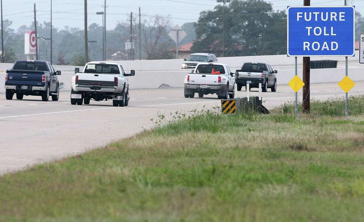 Signs point out that parts of Highway 249 will become a toll road, Friday, Dec. 14, 2012, in Houston. ( Nick de la Torre / Houston Chronicle )