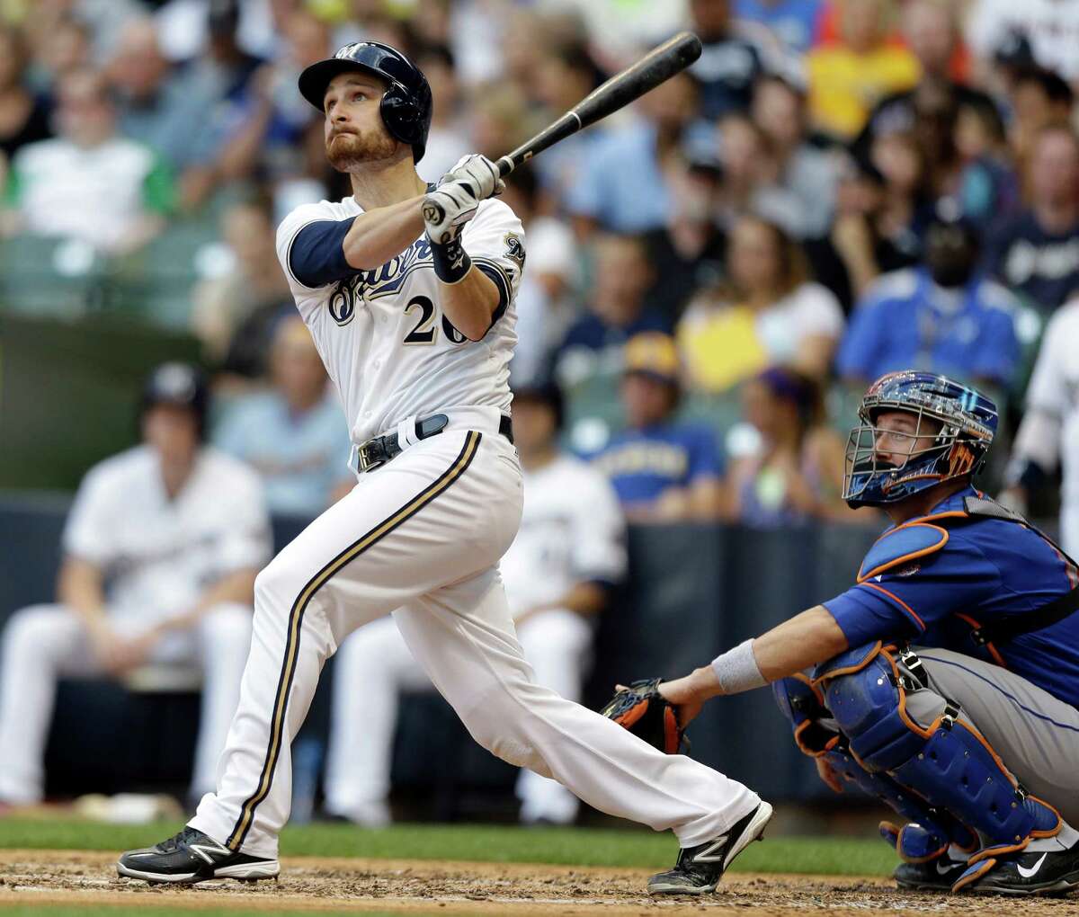 Milwaukee Brewers' Jonathan Lucroy, left, watches his home run against the New York Mets during the third inning of a baseball game on Saturday, July 6, 2013, in Milwaukee. (AP Photo/Jeffrey Phelps) ORG XMIT: WIJP105