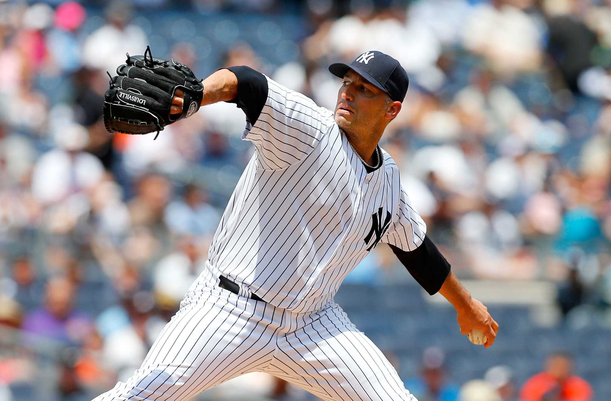 New York Yankees' Andy Pettitte yells into his glove as he walks off  News Photo - Getty Images