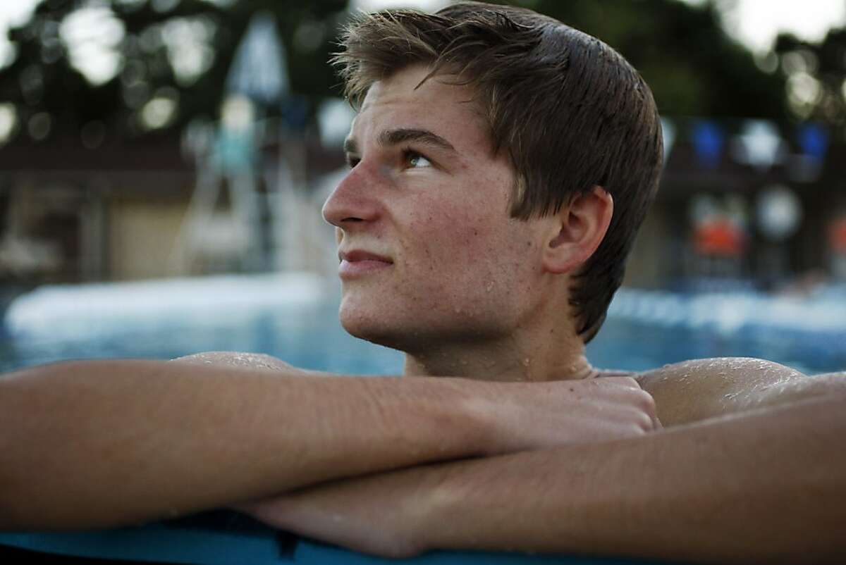 Karsten Kaufmann, 18, poses for a portrait in the pool at The Hills Swim and Tennis Club on Monday, July 08, 2013 in Oakland, Calif. Kaufmann runs track at California State University, Chico, but injured his leg in his freshman season and has been rehabbing through aqua-jogging. Aqua jogging allows the injured Kaufmann to work on his strength without the impact of running on land.