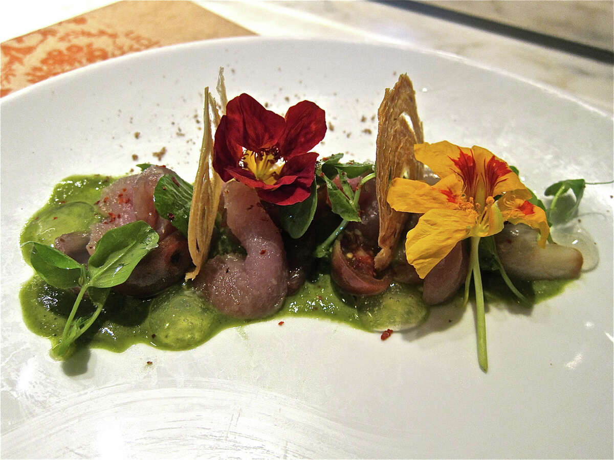 A special of cured albacore with green onion puree, lemon gel, pickled shallot and sweet onion crisps at Uchi Houston.