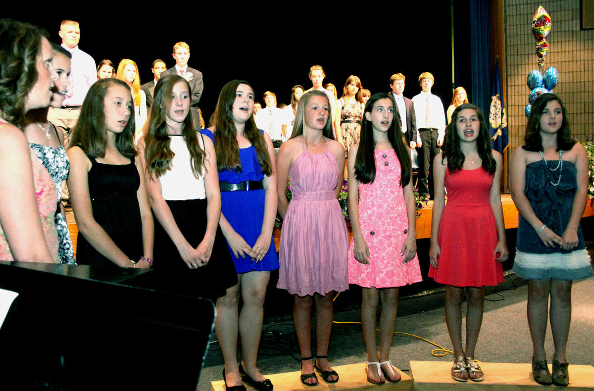The choir performs the Star Spangled Banner during Shepaug Valley Middle School's promotion ceremony for its eighth graders, June 21, 2013 in Washington