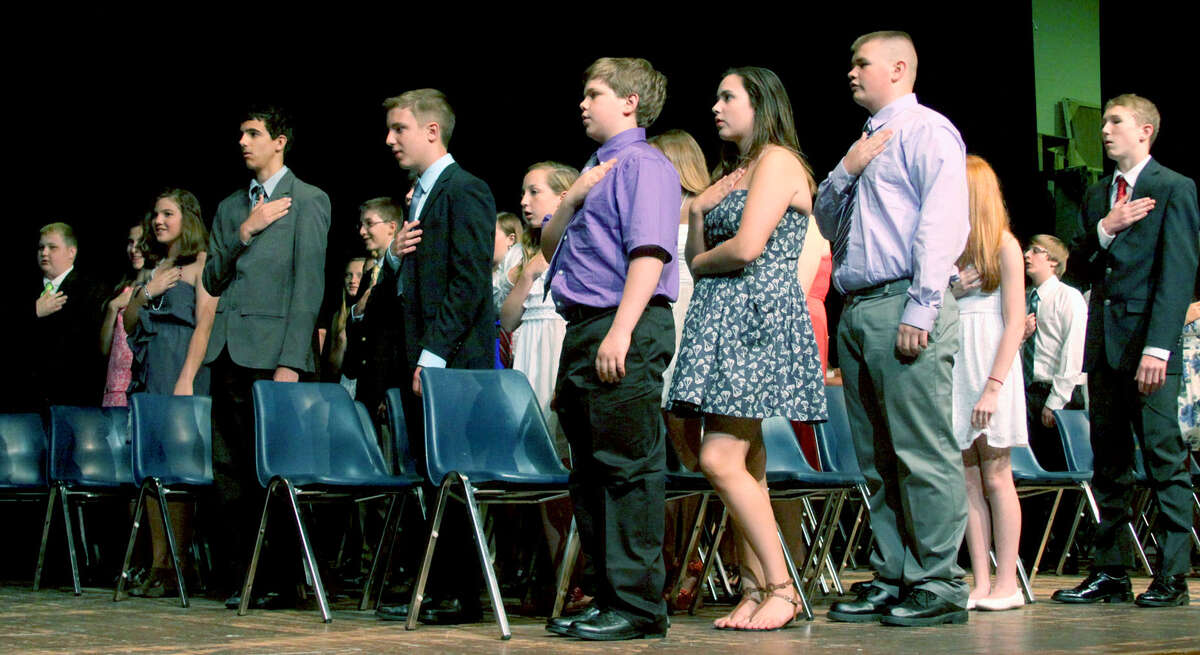 The Class of 2013 offers the Pledge of Allegiance during Shepaug Valley Middle School's promotion ceremony for its eighth graders, June 21, 2013 in Washington