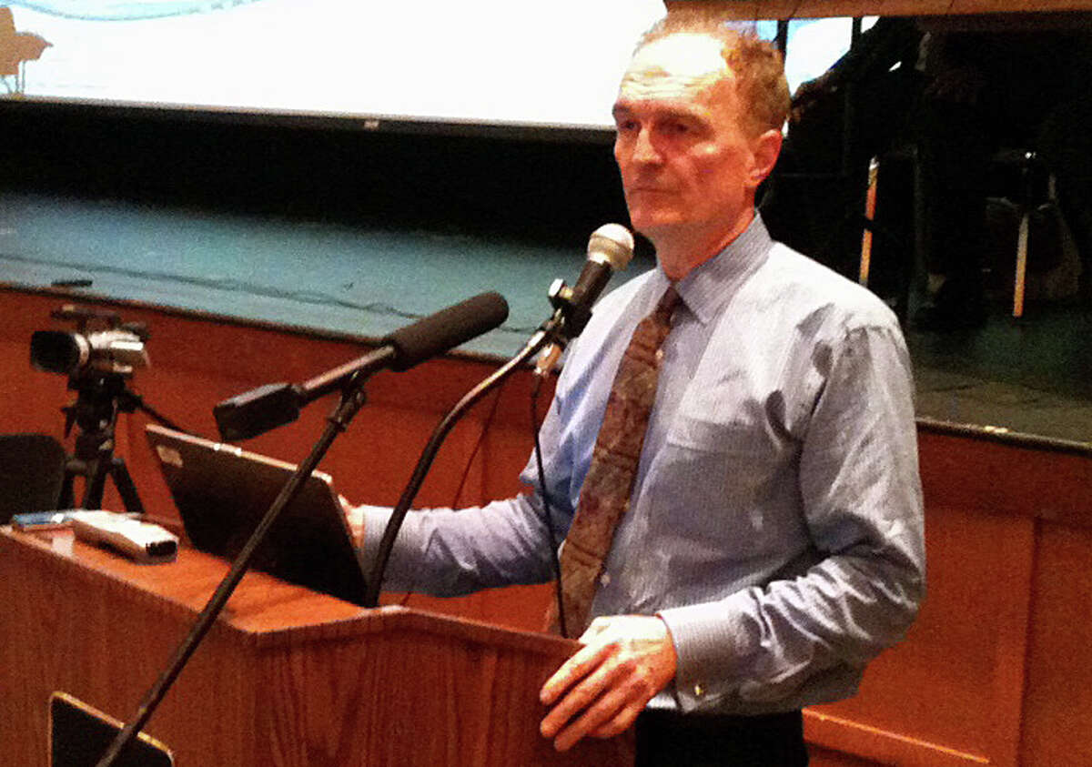 Charles Firlotte, CEO and president of Aquarian Water Co., makes a presentation Tuesday night during the Public Utilities Regulatory Authority's second public hearing in Fairfield on Aquarion's proposed rate hikes.