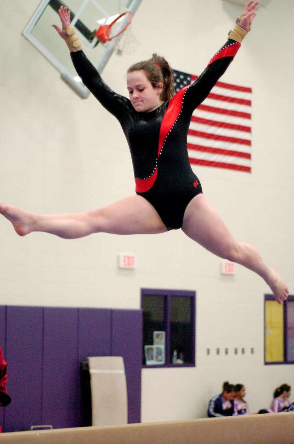 Jaclyn Golet from Pomperaug competes at gymnastics meet at Westhill High School in Stamford, Conn. on Monday January 18, 2010. Westhill and Pomperaug are two of the schools competing.